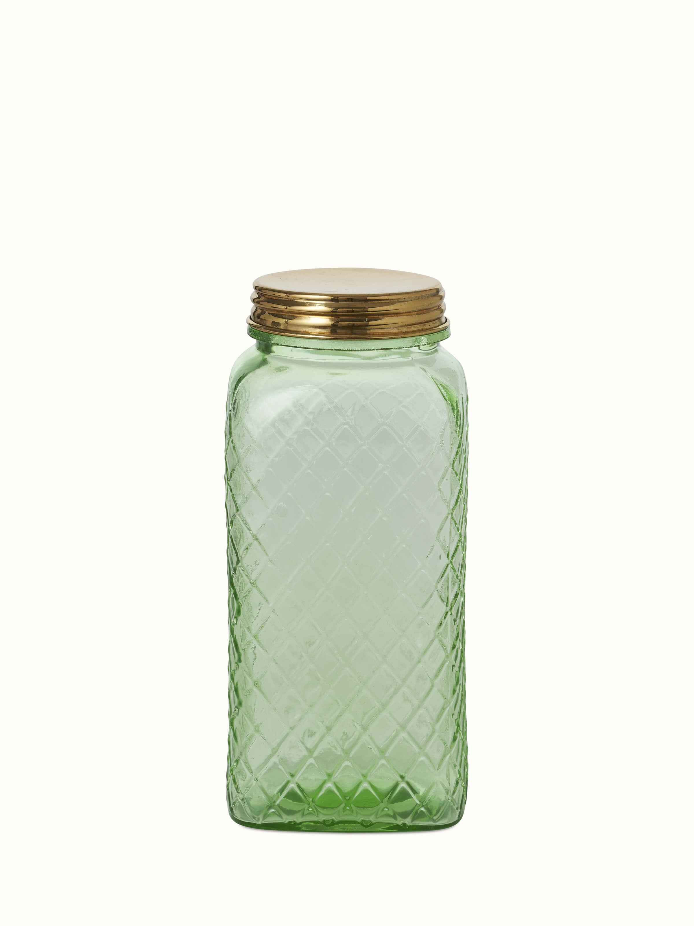 Close-up view of green glass-worked storage containers, focusing on the craftsmanship and glasswork details.