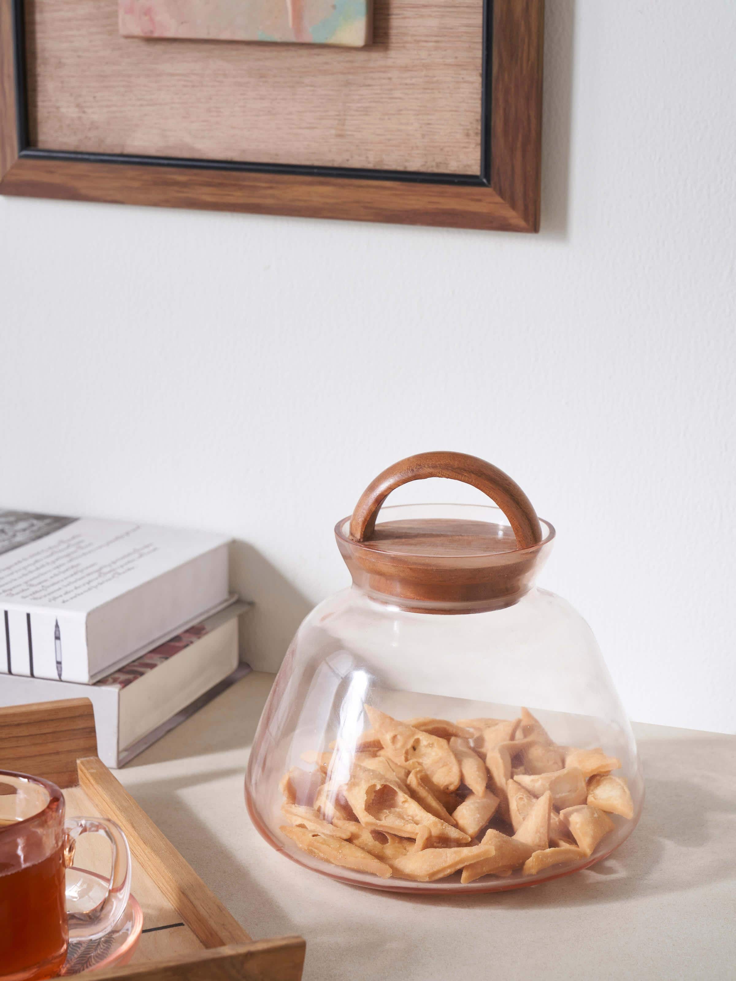 Side view of pink glass-worked storage container displaying its elegant shape and high-quality glasswork