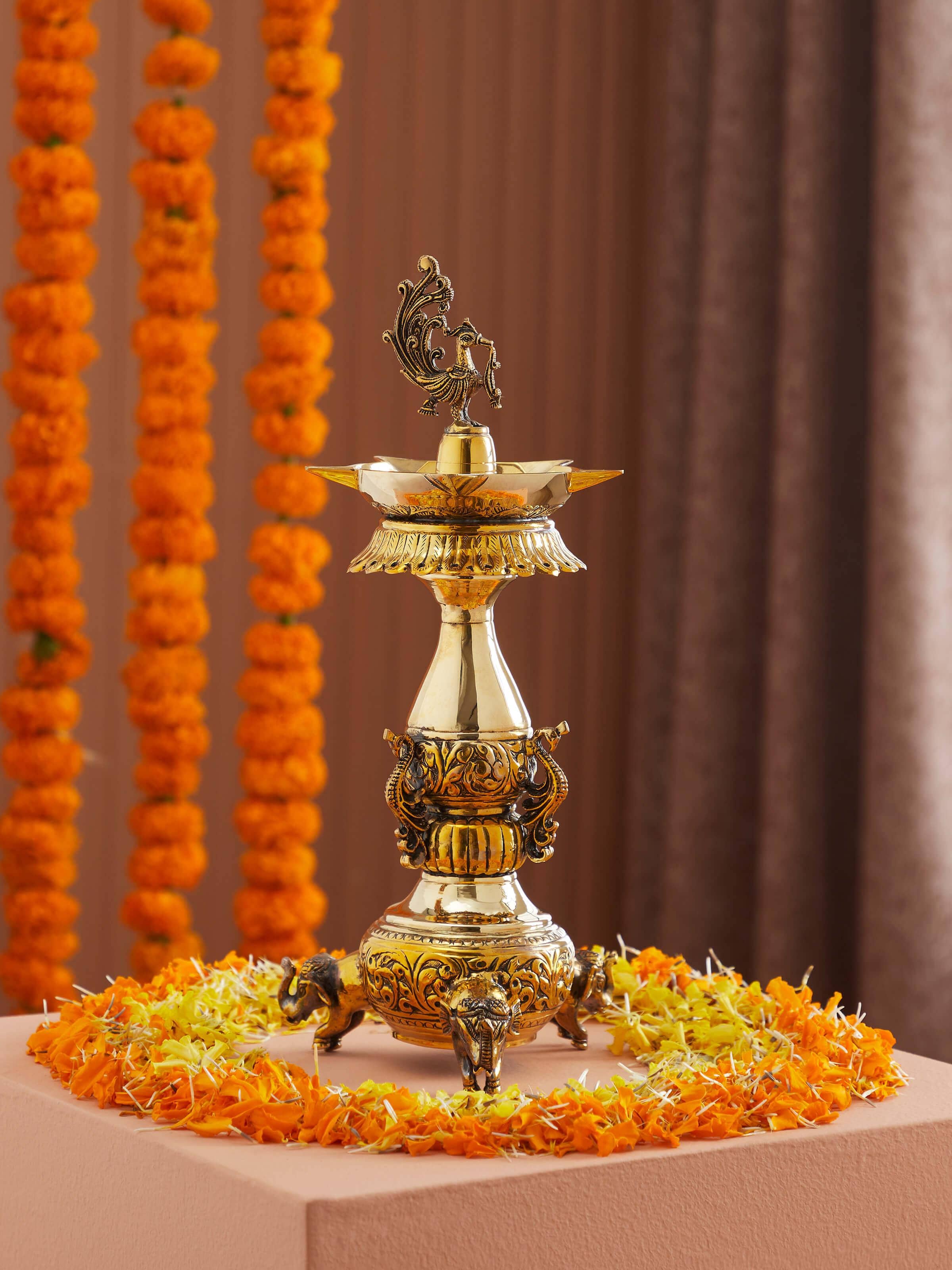 Side view of Polished Brass Kalash Vilakku, showcasing the fine craftsmanship and traditional design.