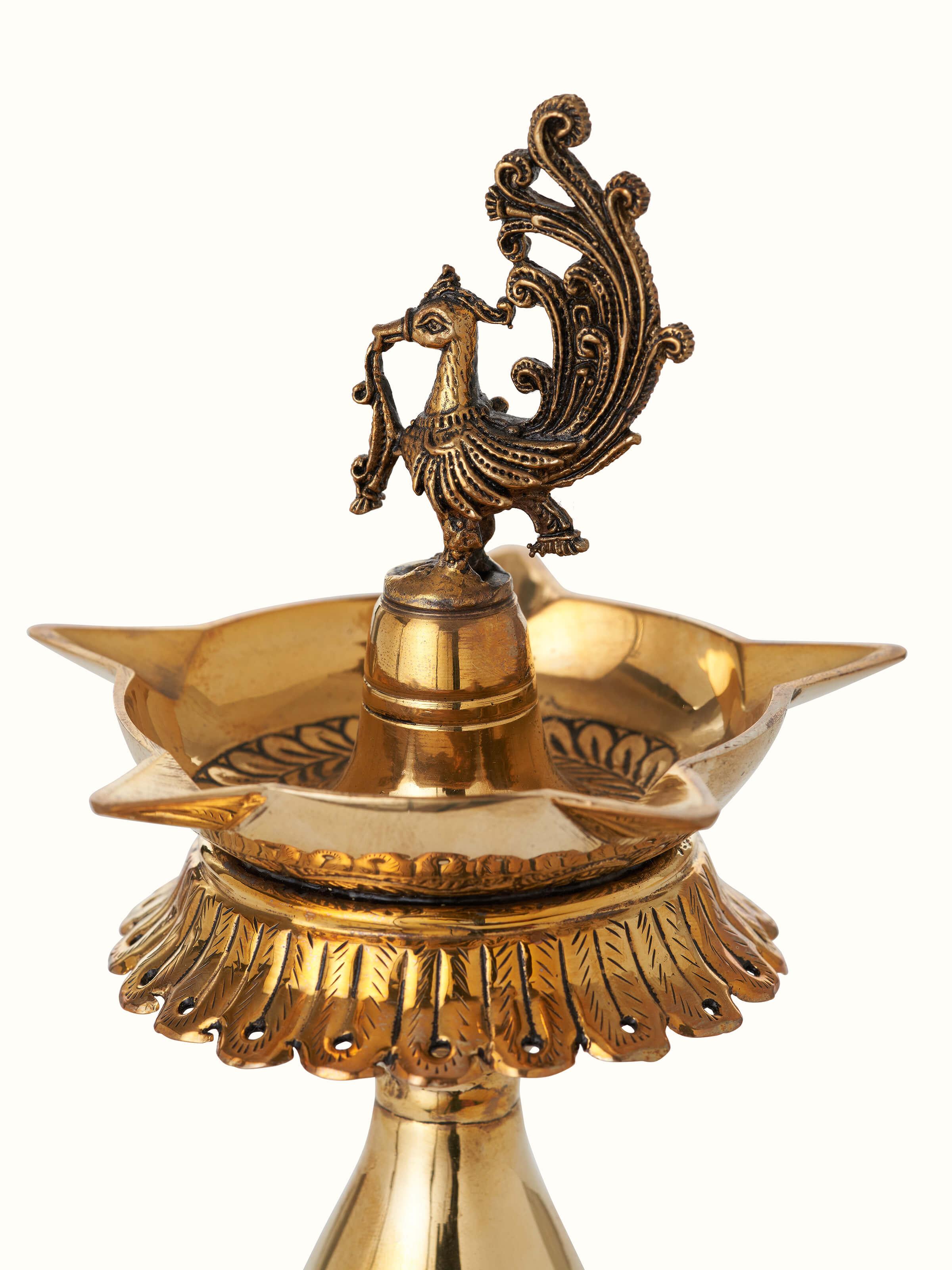 Angled view of Polished Brass Kalash Vilakku, emphasizing the elegant curves and polished brass texture.