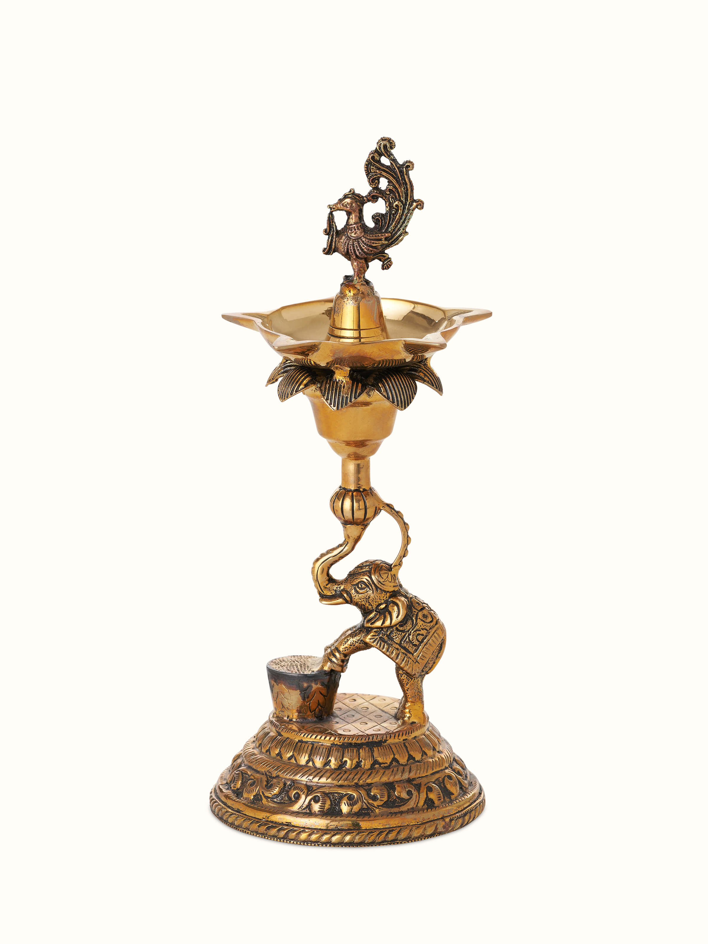 Polished brass Gajanan vilakku with intricate design, showcasing its shine and traditional craftsmanship.