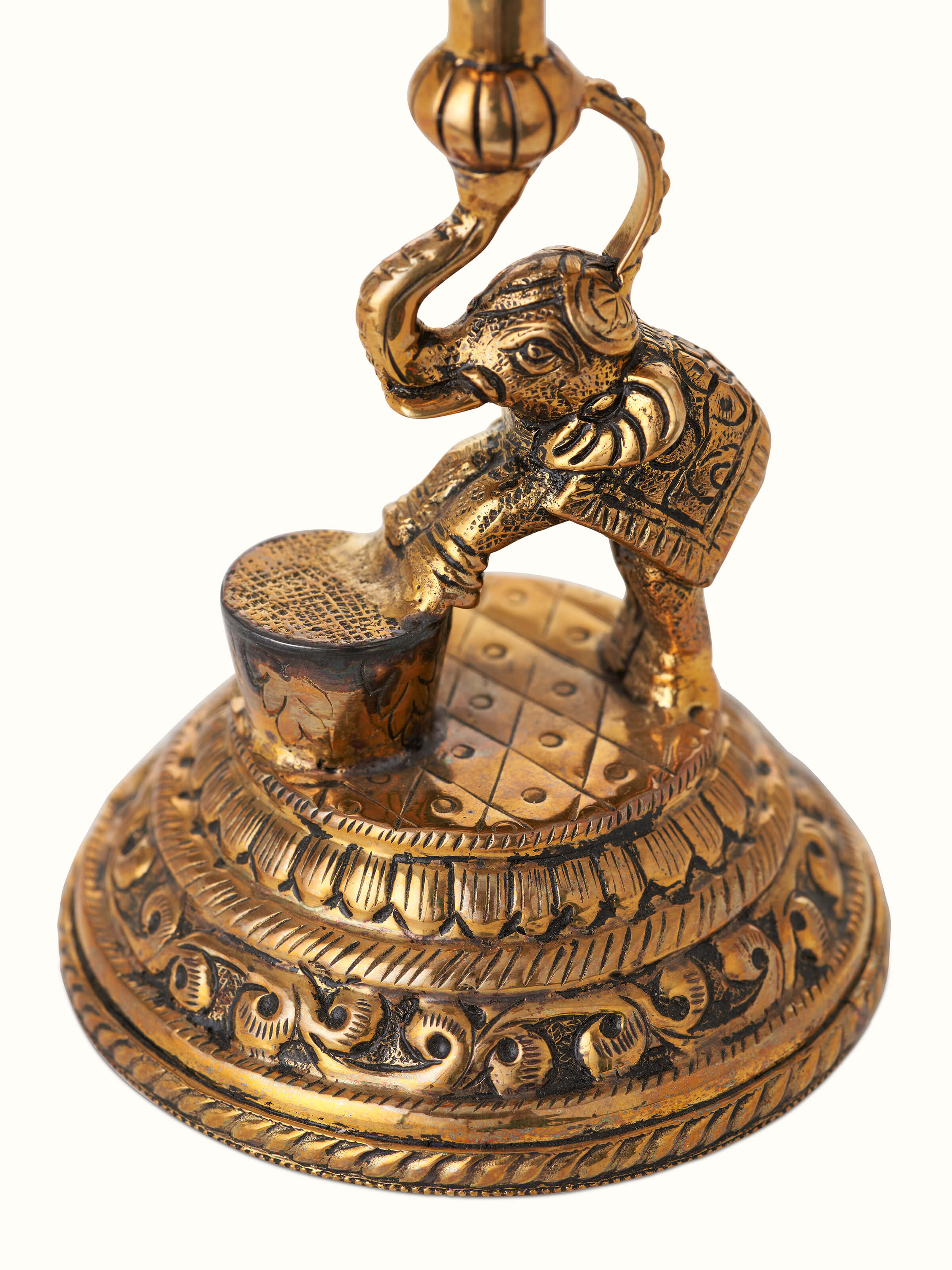 Detailed view of polished brass Gajanan vilakku showing the high-quality brasswork and intricate design.