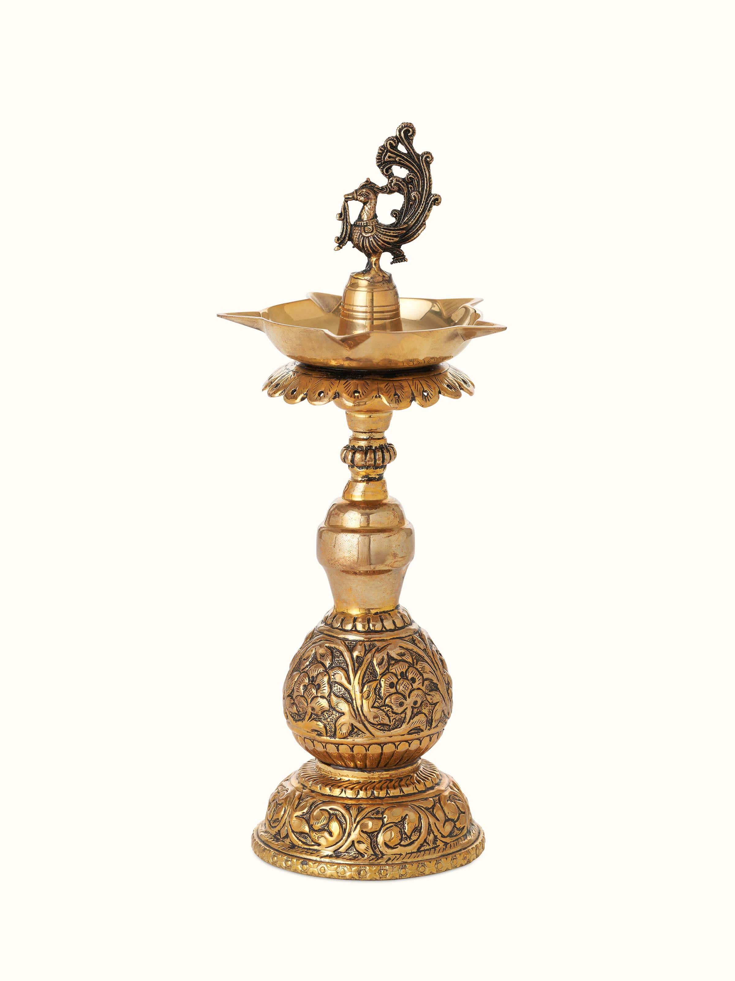 Front view of polished brass Stambh Vilakku showcasing elegant brass work and traditional design