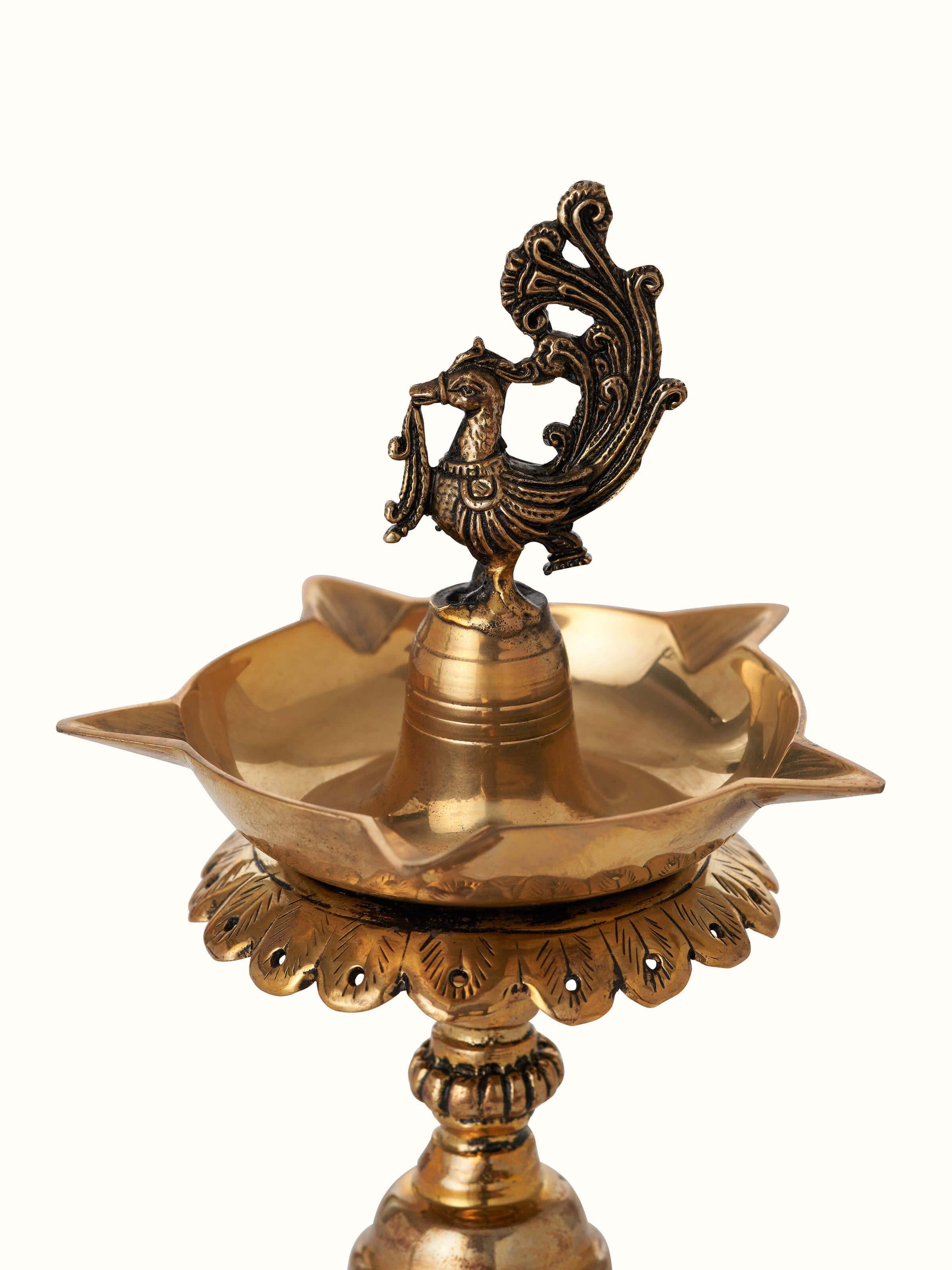 Back view of polished brass Stambh Vilakku showing fine details and traditional brass work
