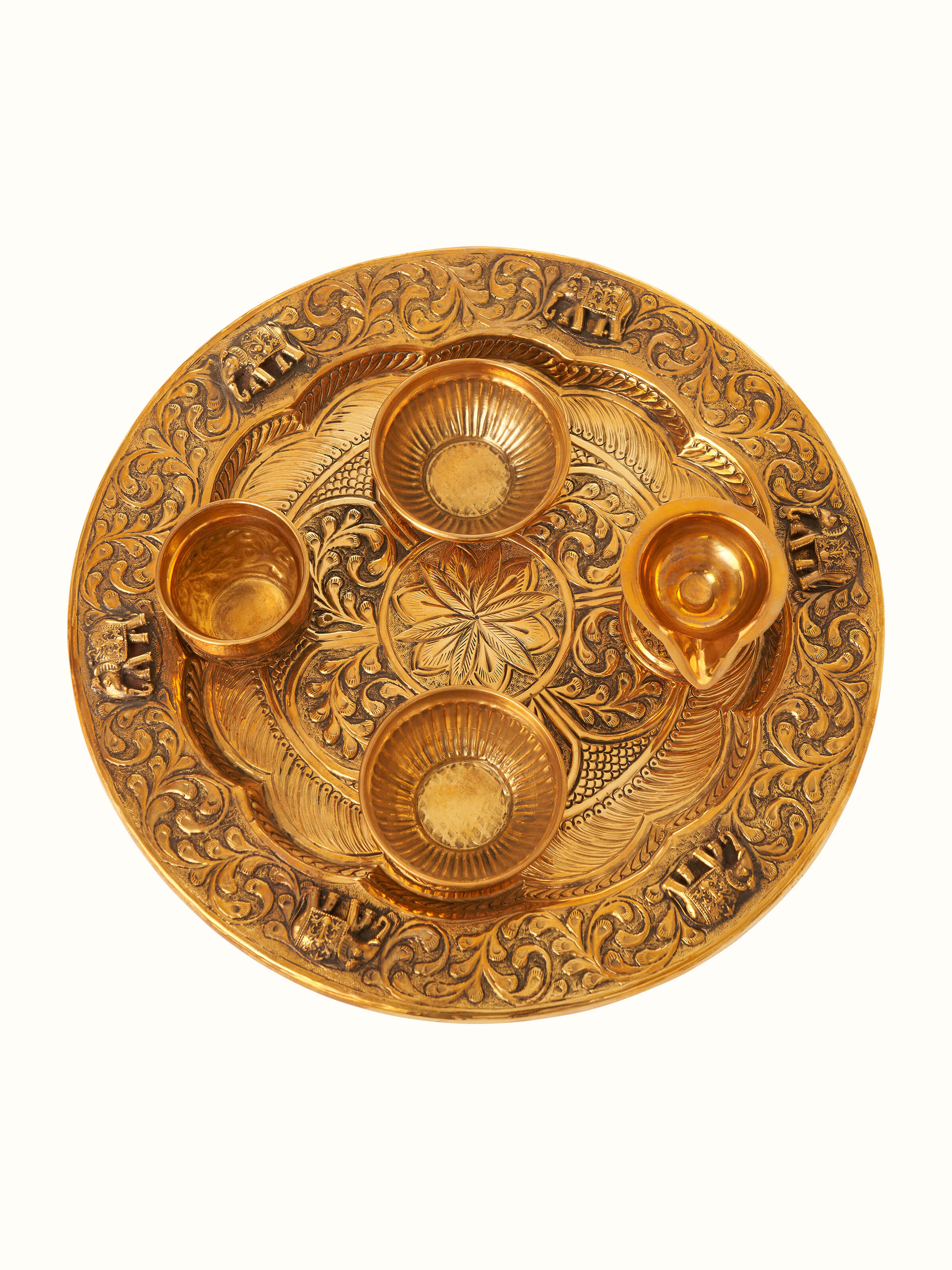 Front view of Polished brass Gajanan pooja thali showcasing elegant design and reflective surface.