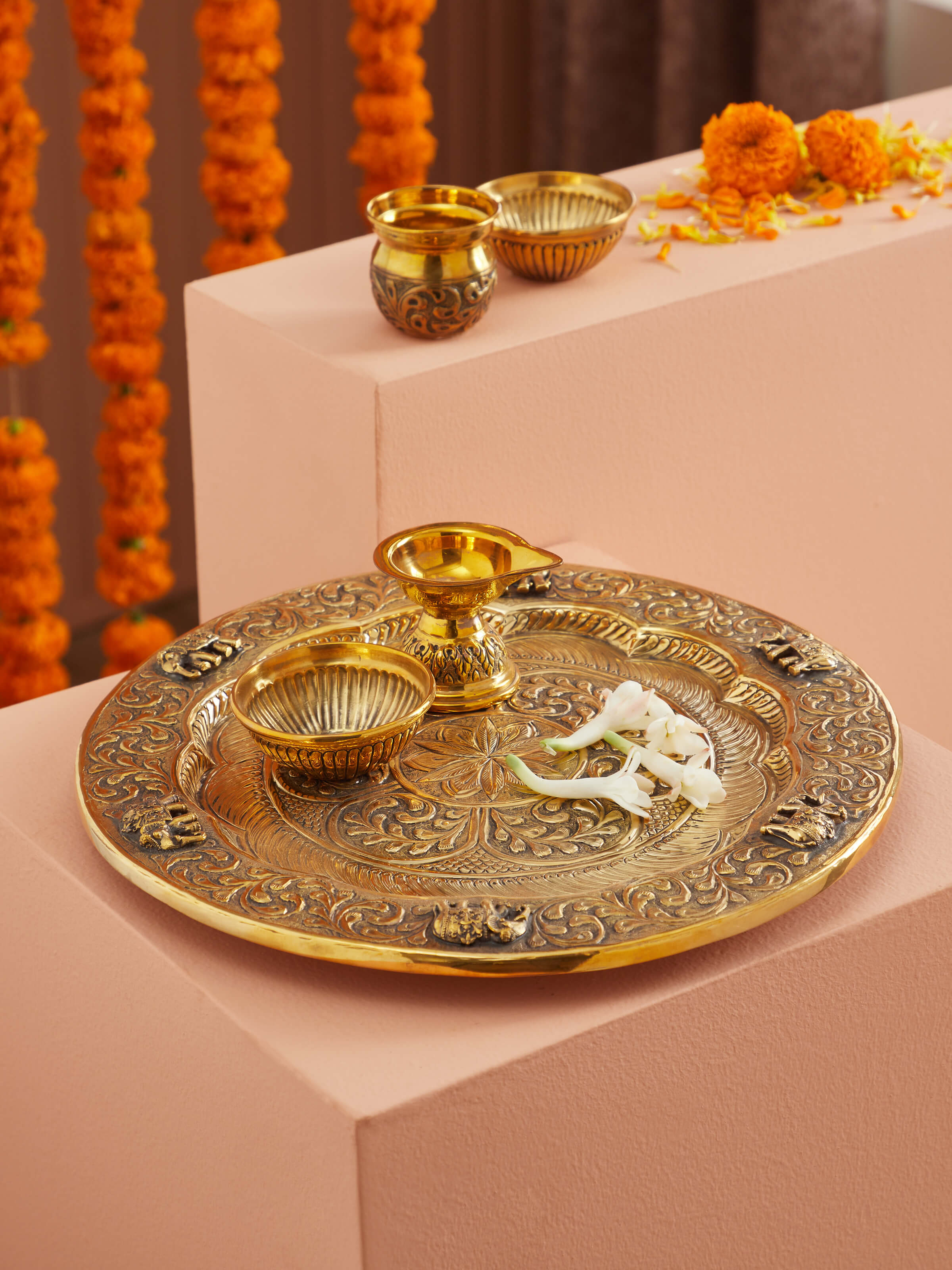 Side view of Polished brass Gajanan pooja thali highlighting detailed engravings and polished finish.