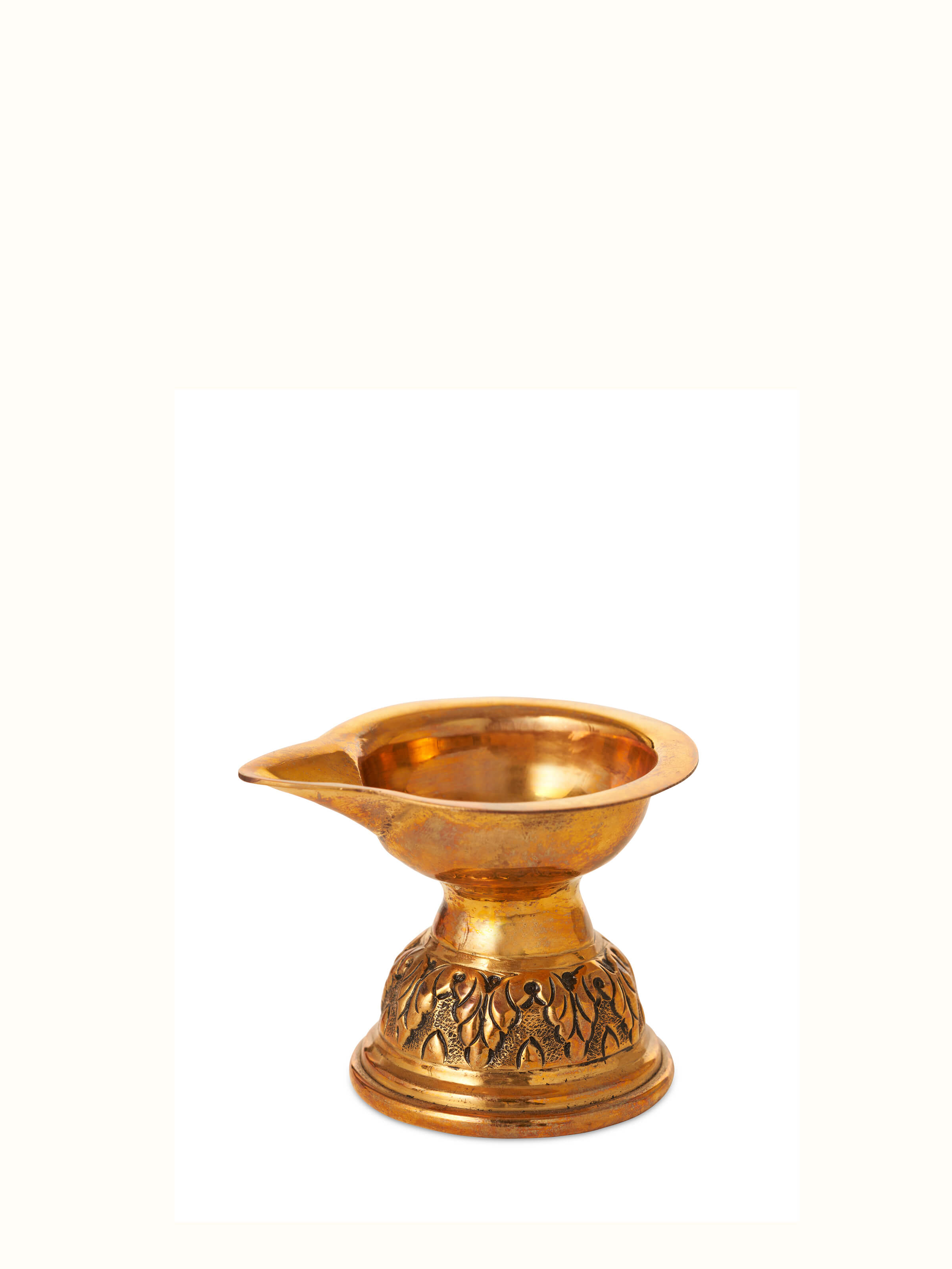 Angled view of Polished brass Gajanan pooja thali emphasizing the detailed engravings and polished surface.
