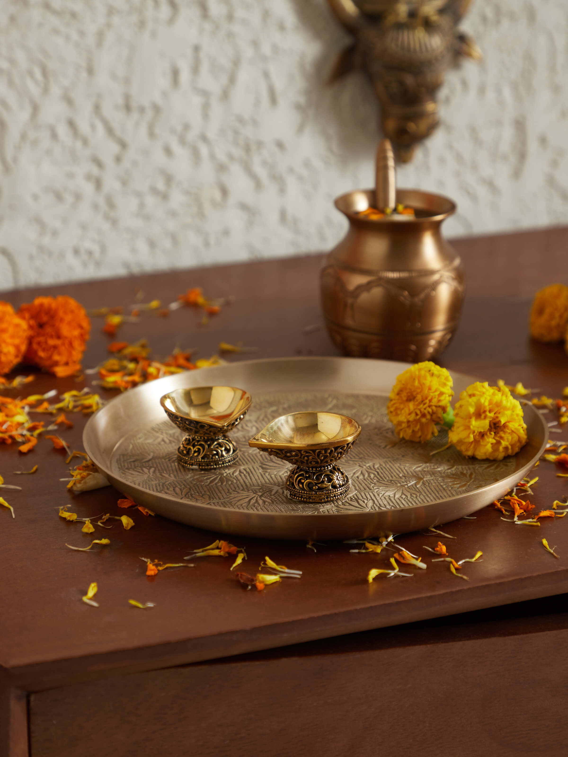 Side view of Polished brass diya small showcasing its compact size and elegant detailing