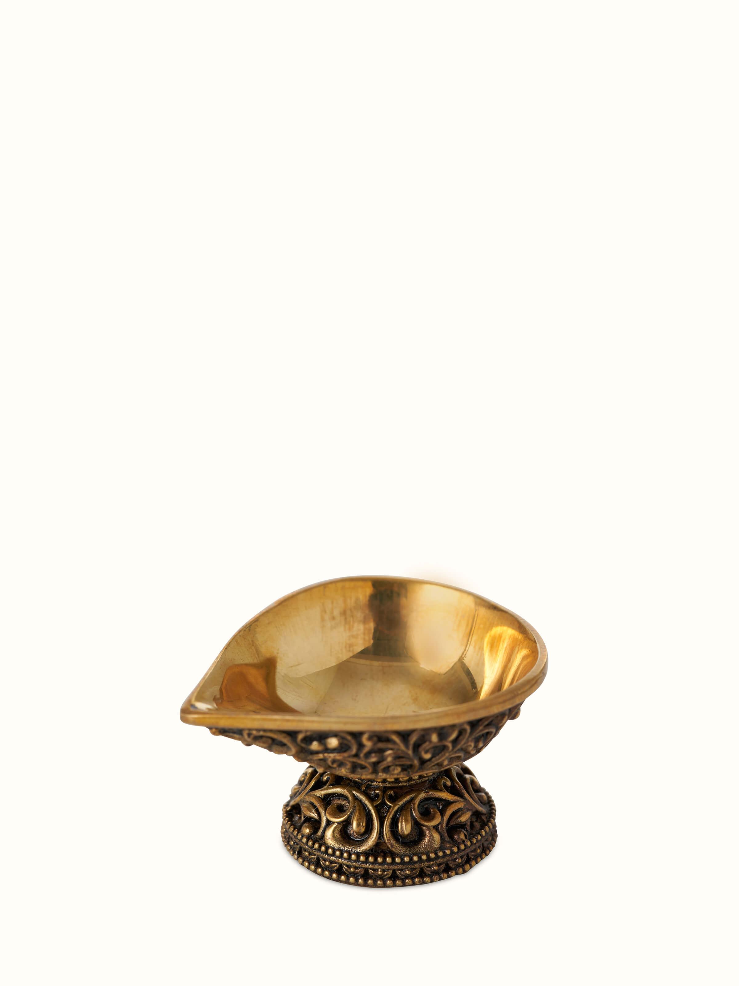 Close-up view of Polished brass diya small emphasizing the fine brass finish and intricate design