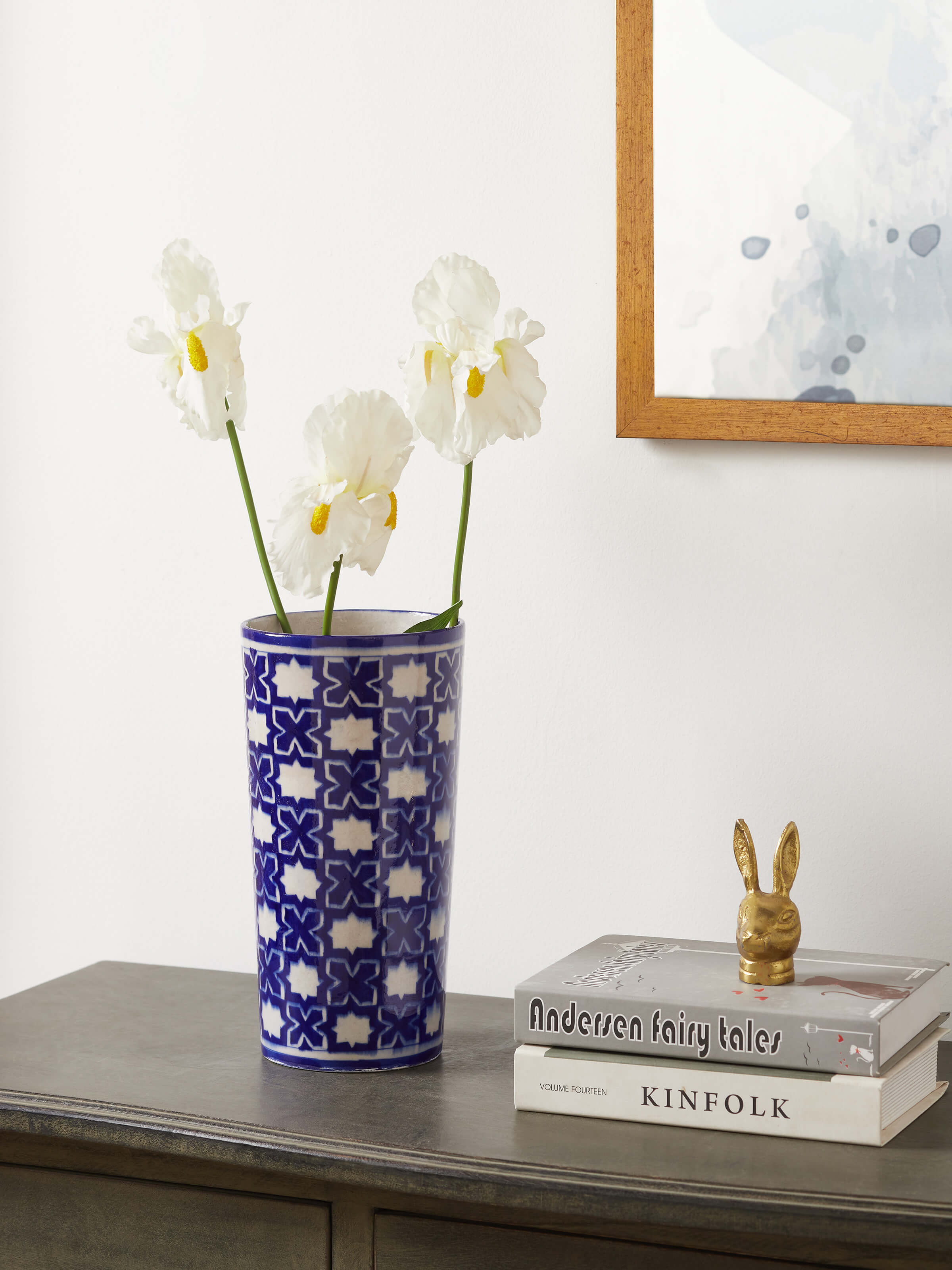 Front view of a blue pottery ceramic table vase, highlighting its traditional design and vibrant colors.