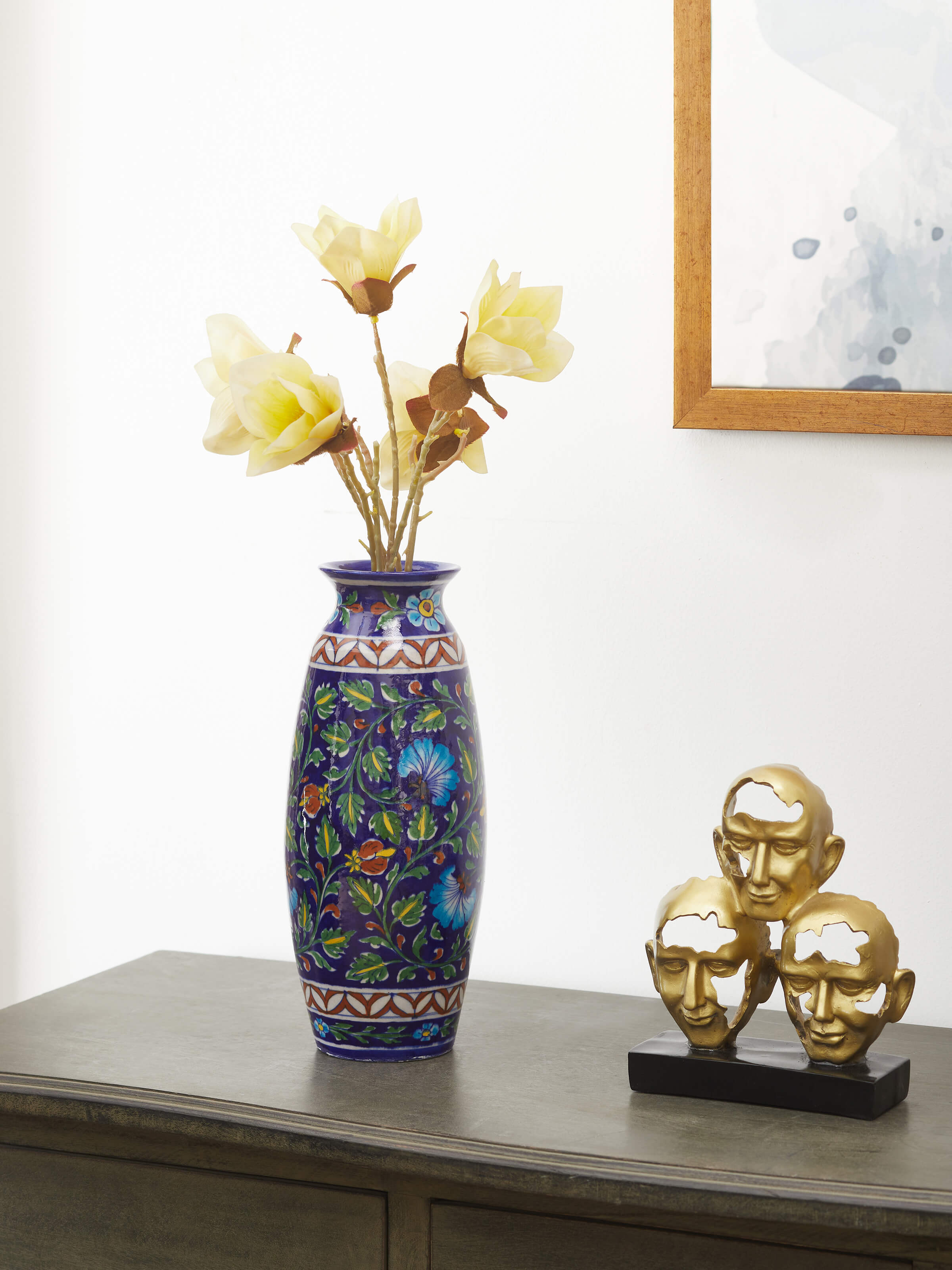 Side view of Glossy blue pottery ceramic table vase highlighting the smooth texture and rich color