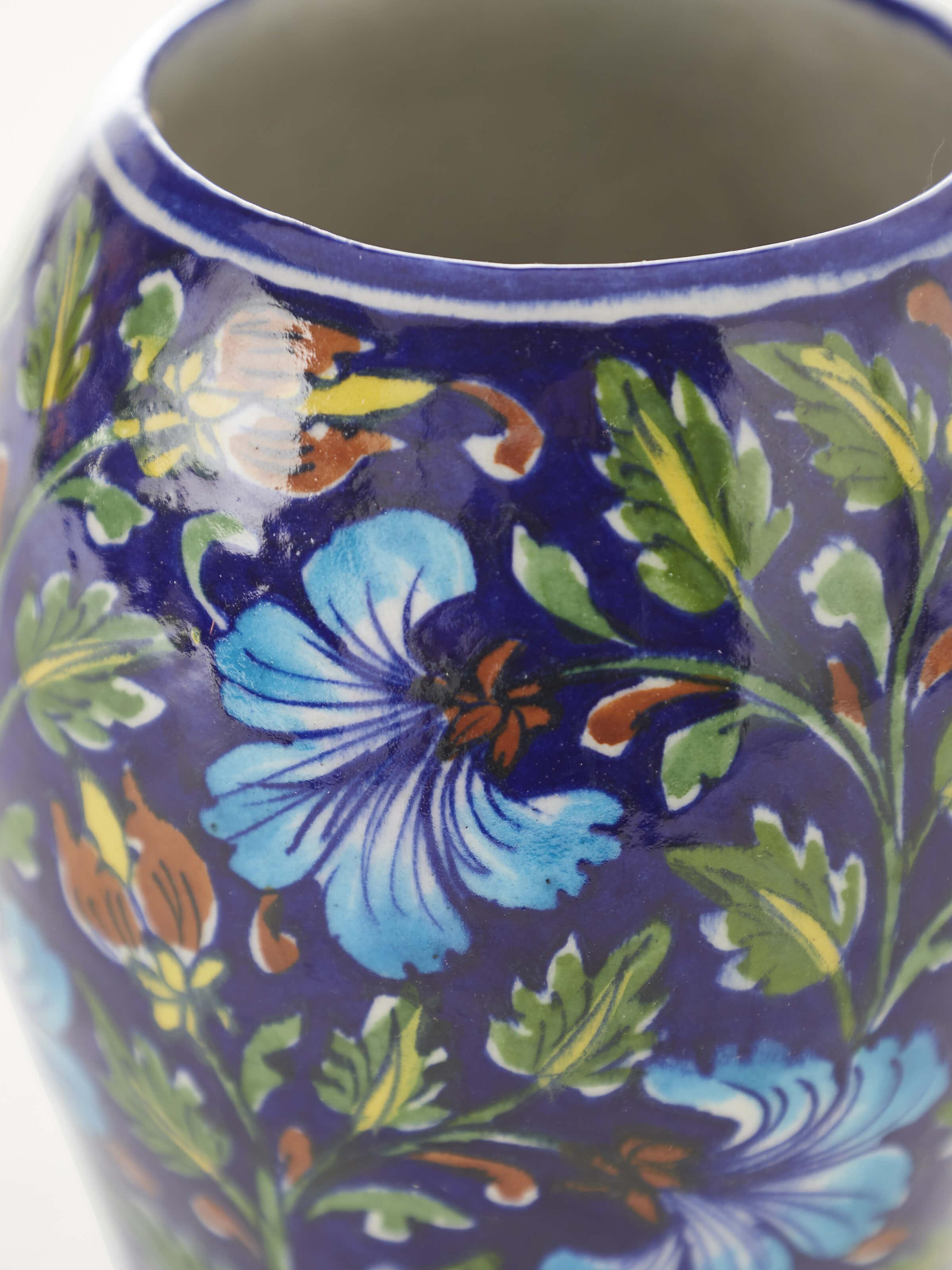 Close-up of Traditional blue pottery ceramic table vase emphasizing fine details and craftsmanship