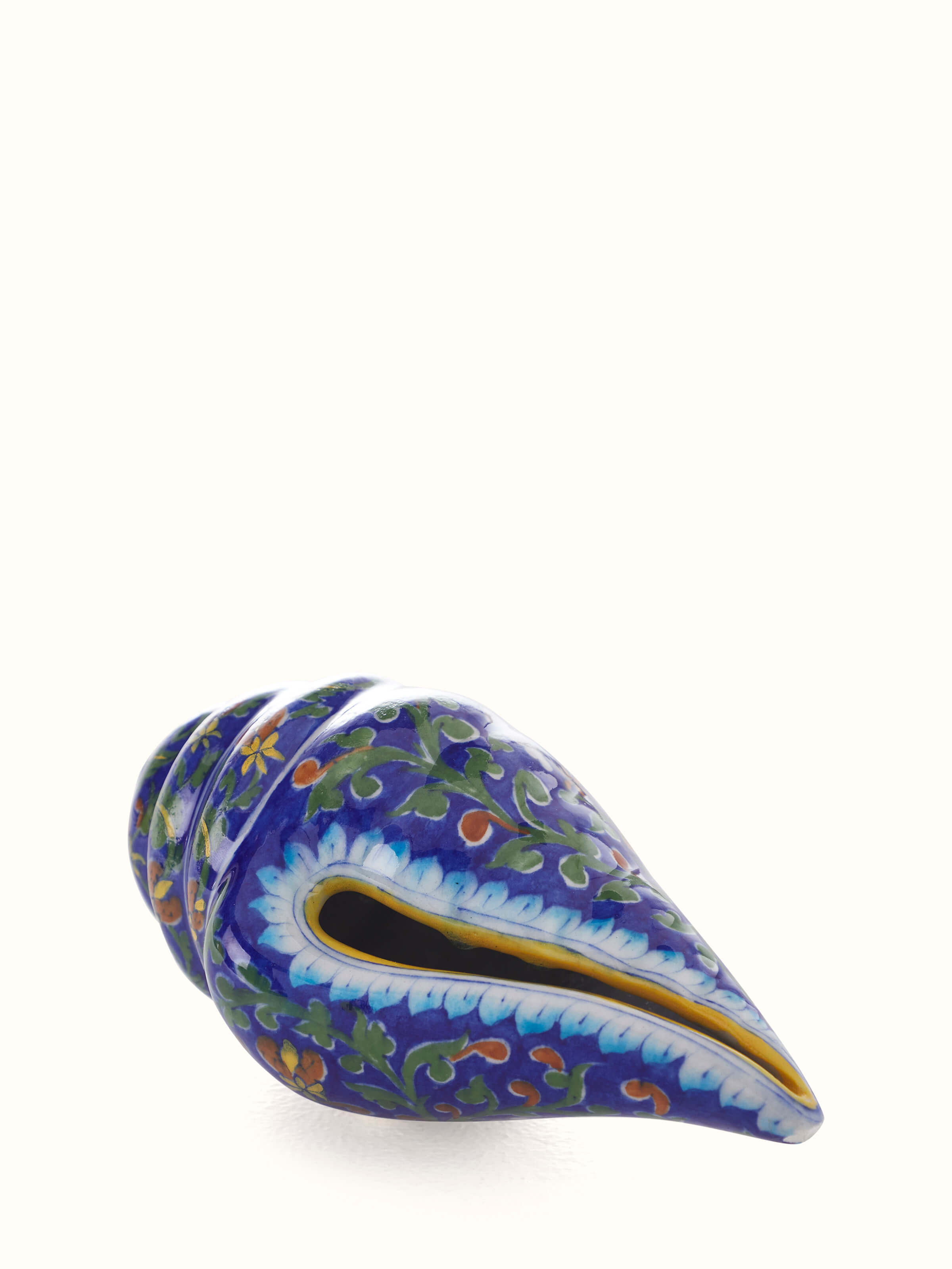 Front view of Blue pottery ceramic garden shell artpiece in indigo color showcasing vibrant blue glaze.