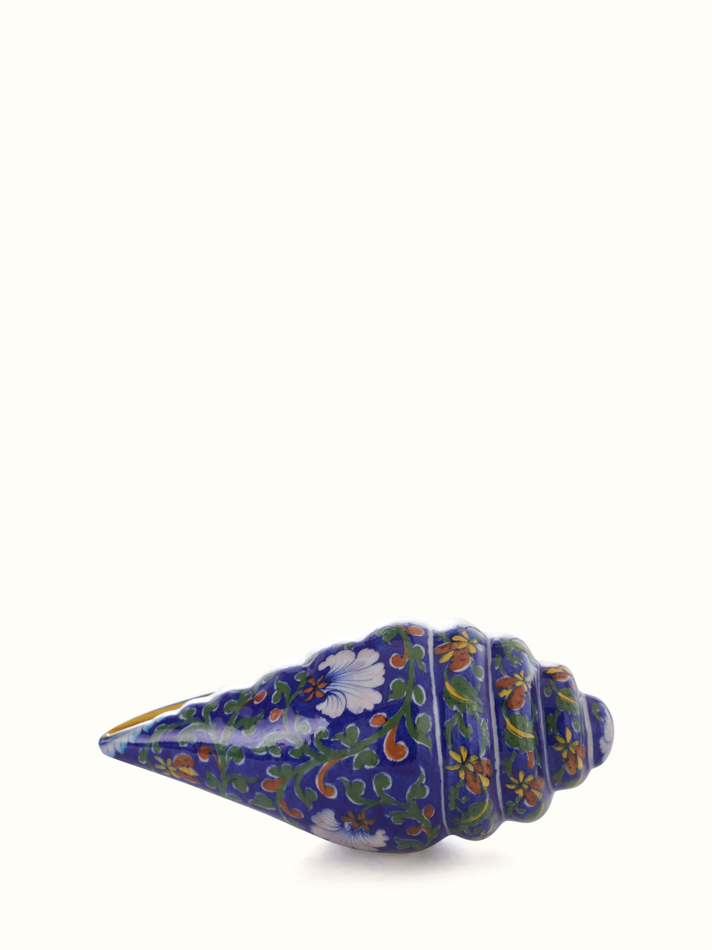 Full view of Blue pottery ceramic garden shell artpiece in indigo color highlighting its artistic design.