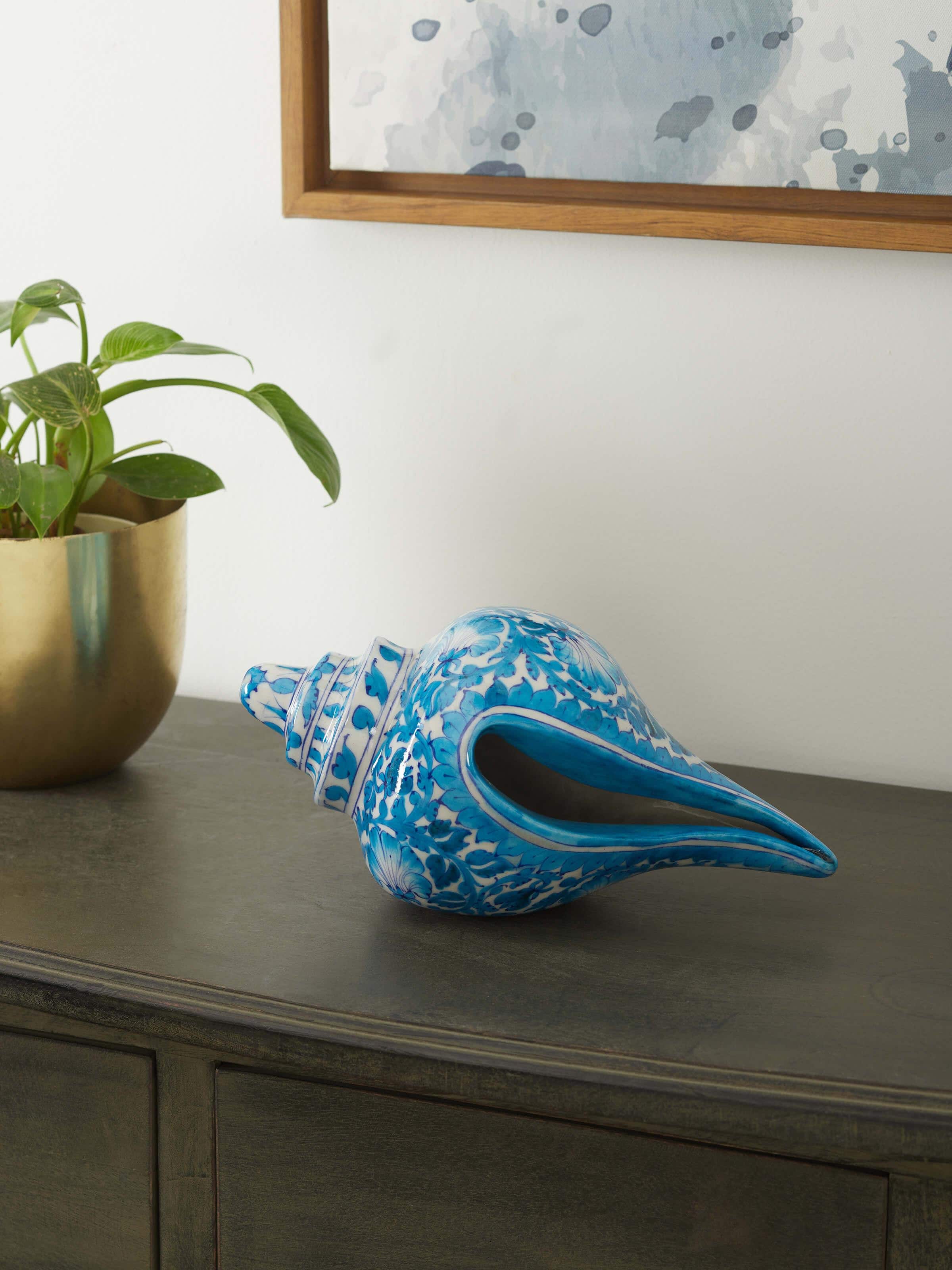 Side view of blue pottery ceramic buds and bloom shell artpiece
