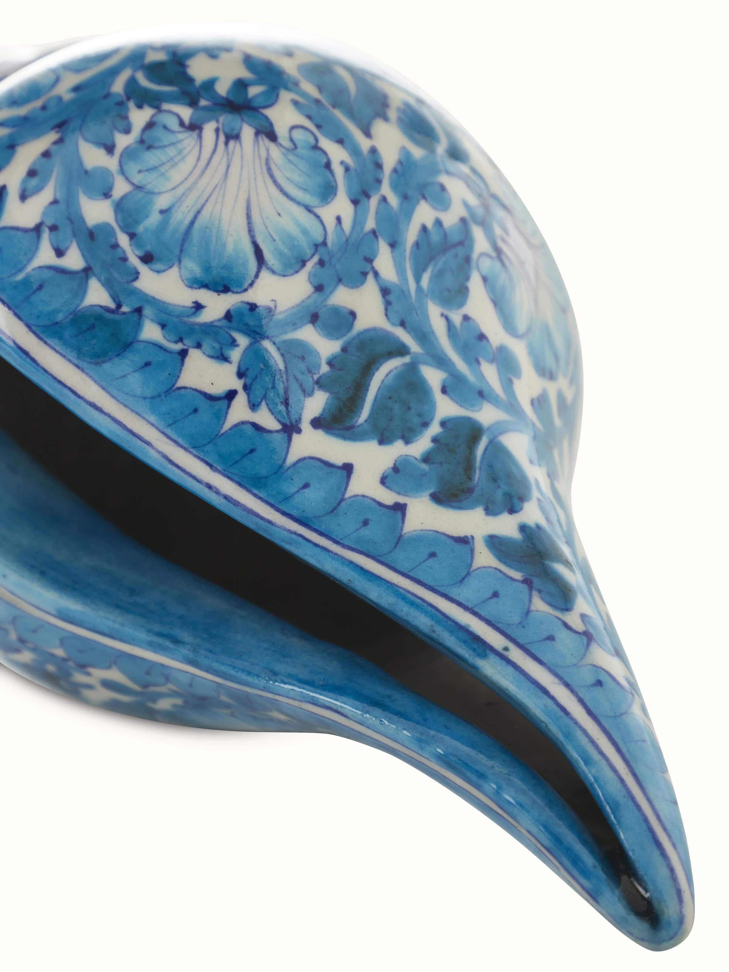 Detailed view of blue pottery ceramic buds and bloom shell artpiece