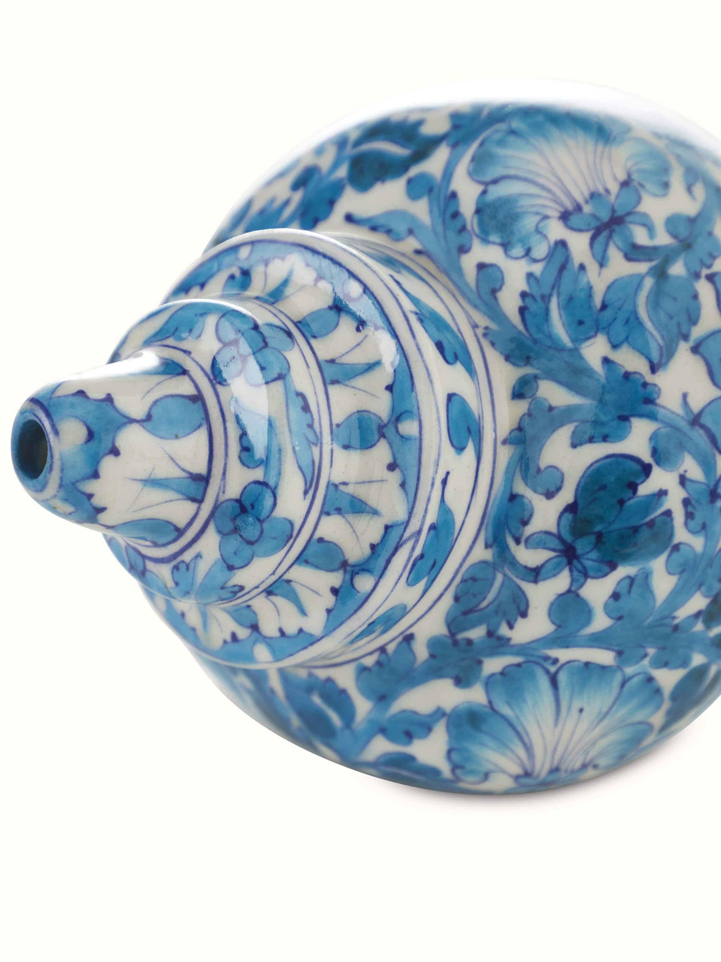 Close-up of blue pottery ceramic buds and bloom shell artpiece