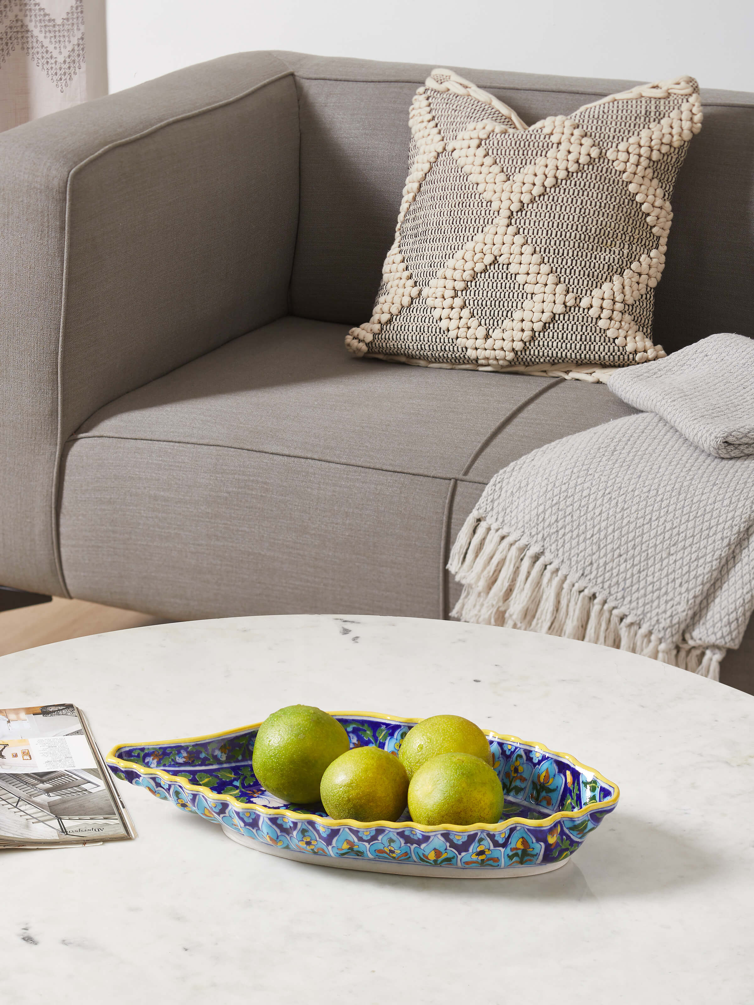 Side view of blue pottery ceramic conch shell planter, emphasizing its conch shell shape and detailed craftsmanship.