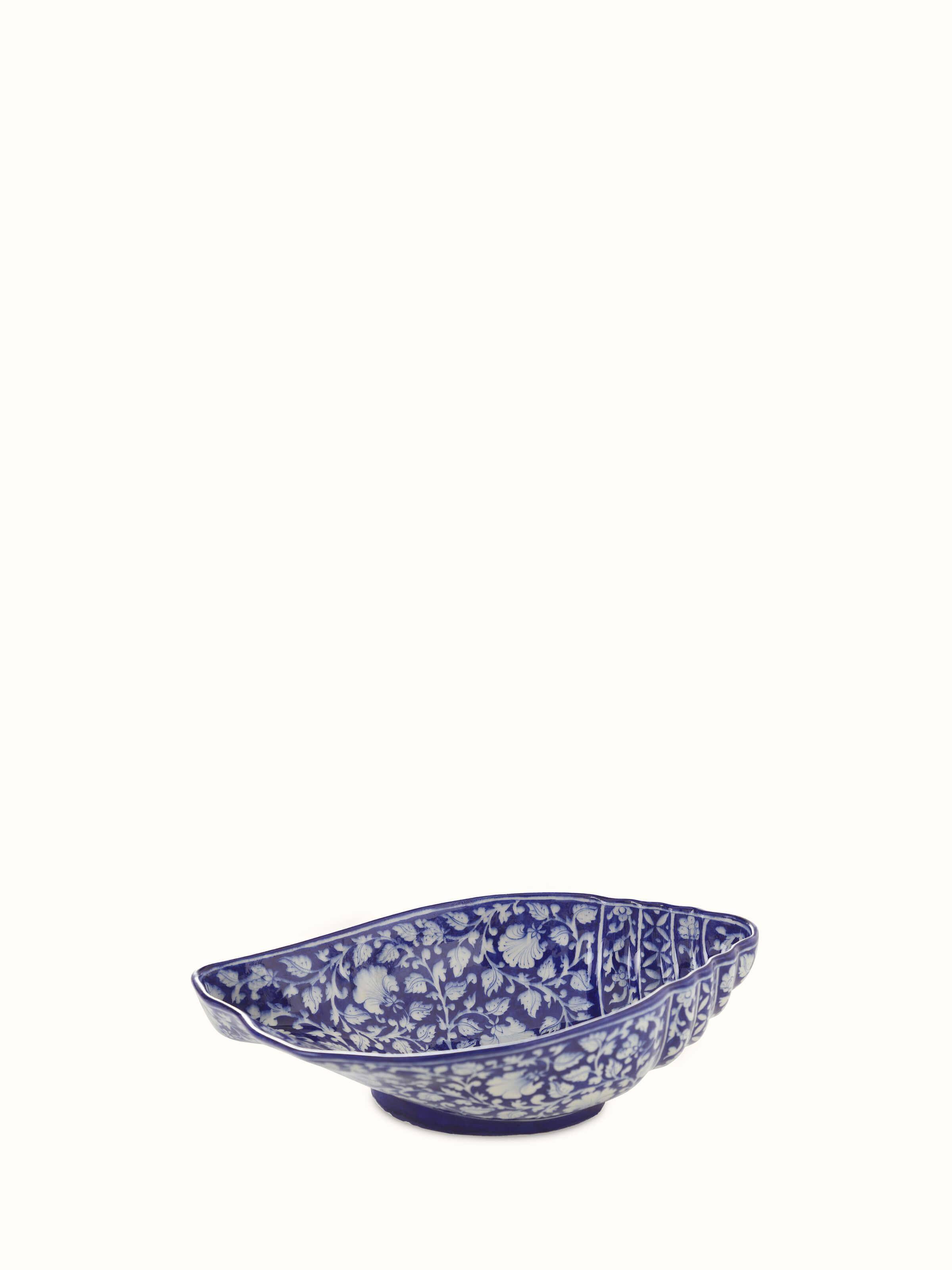 Close-up of Glossy blue pottery ceramic conch shell planter emphasizing fine detailing.