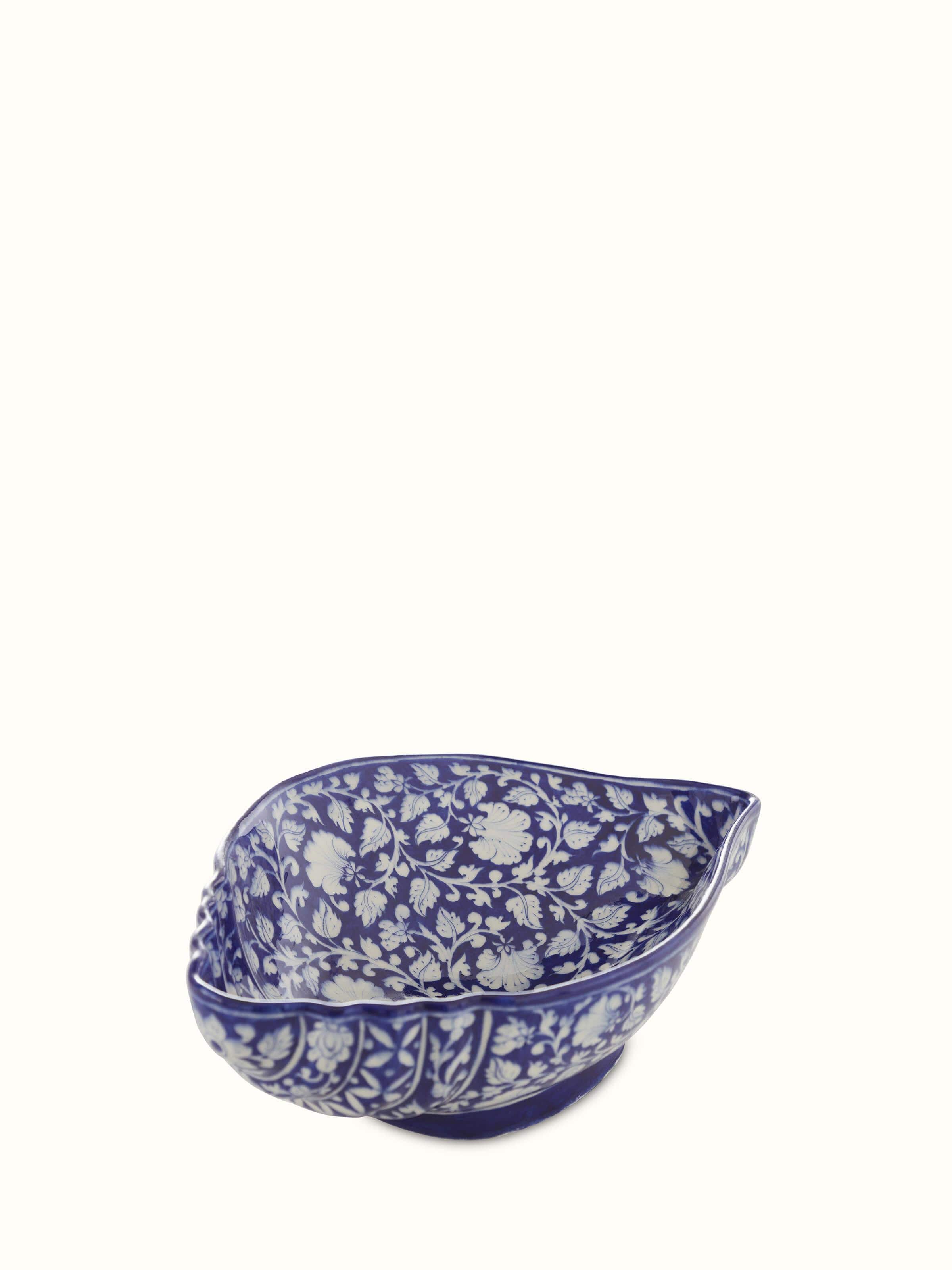 Detailed view of Glossy blue pottery ceramic conch shell planter showcasing glossy finish.