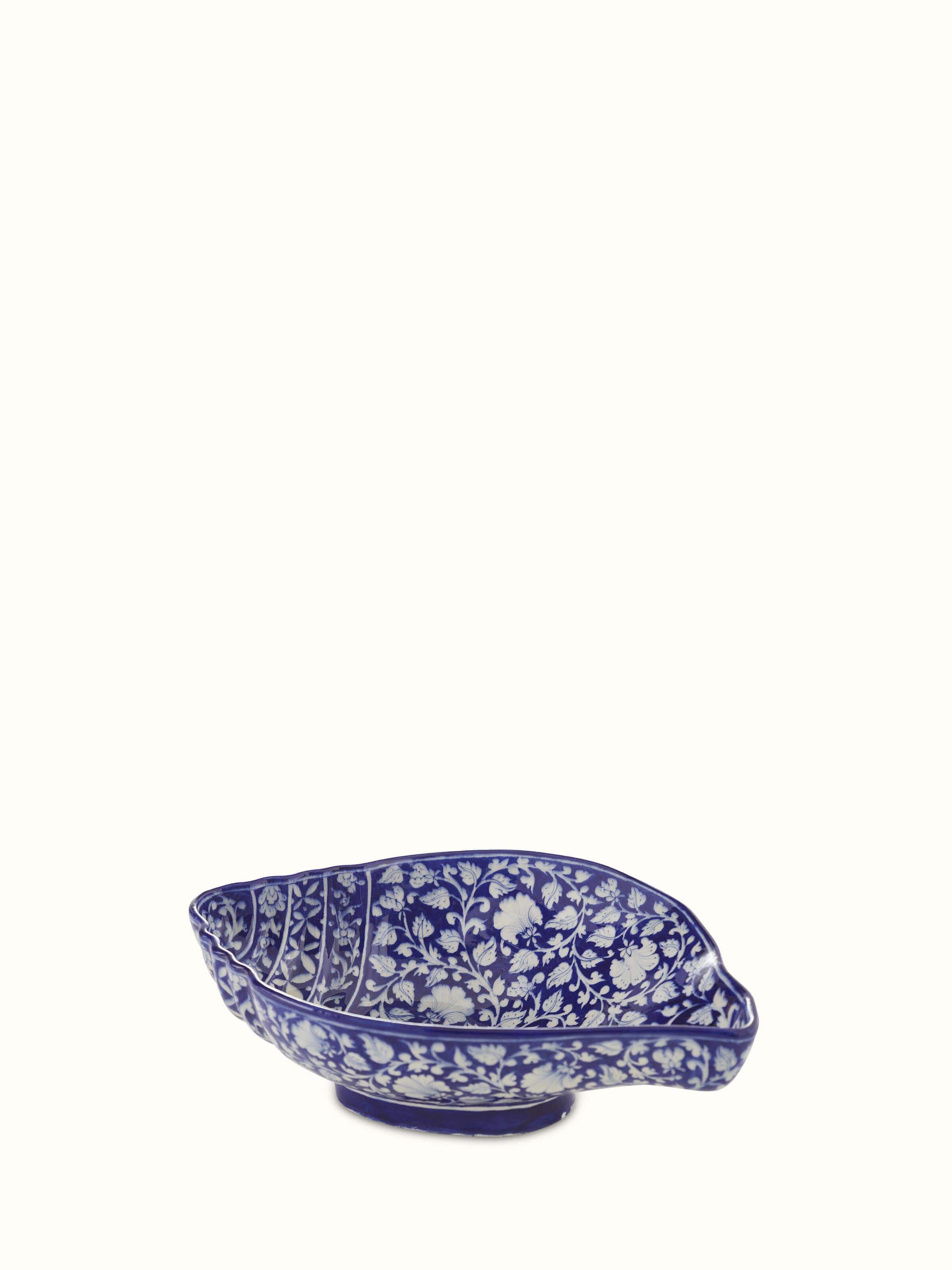 Full view of Glossy blue pottery ceramic conch shell planter highlighting its vibrant blue color.