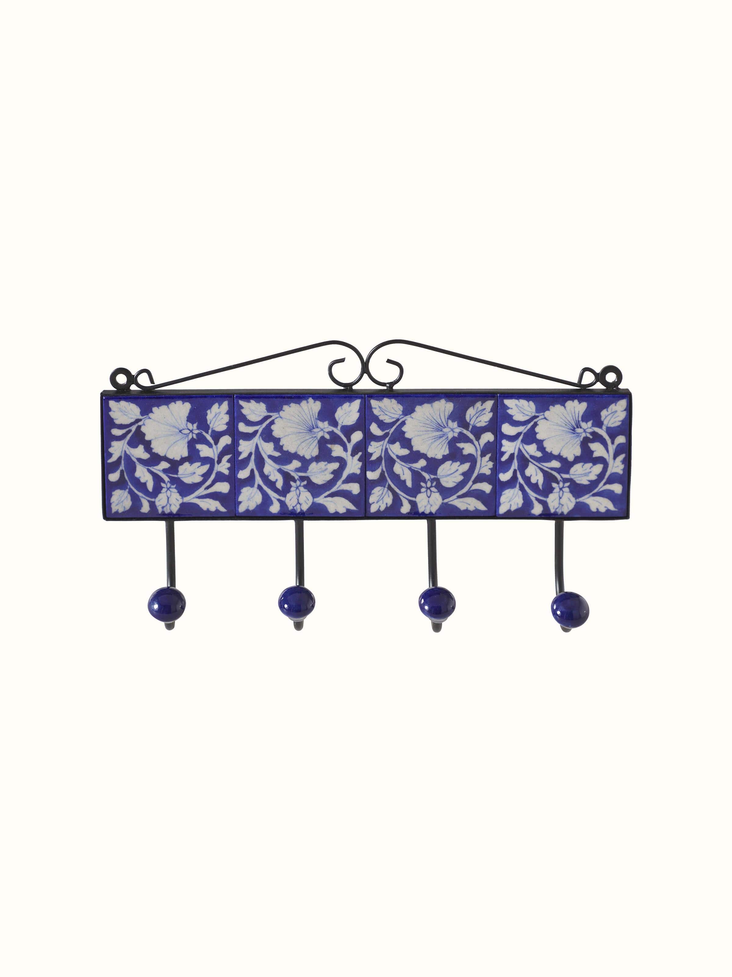 Front view of Glossy blue pottery ceramic 4-pin wall hook showcasing vibrant color and design