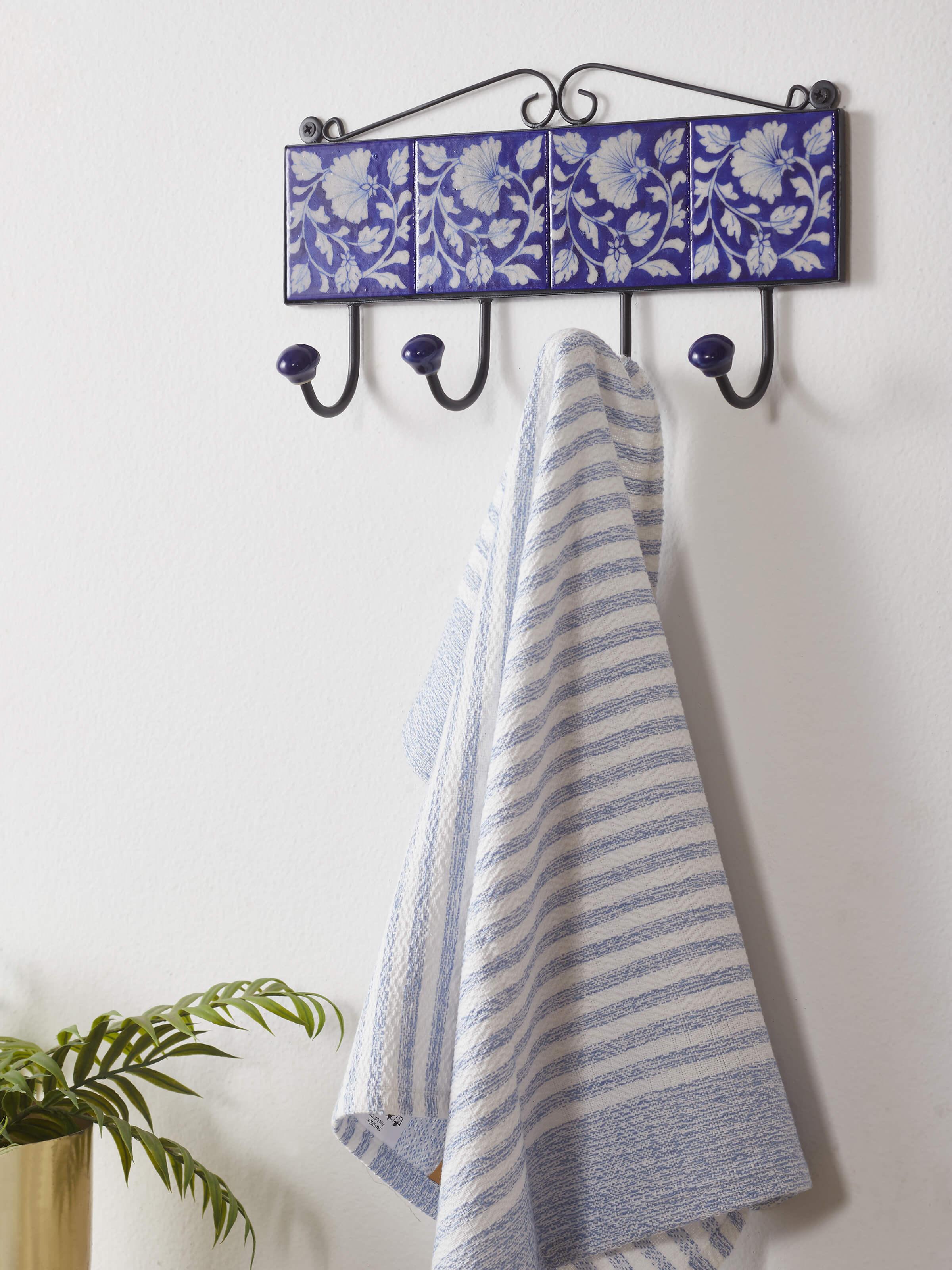 Side view of Glossy blue pottery ceramic 4-pin wall hook highlighting intricate detailing