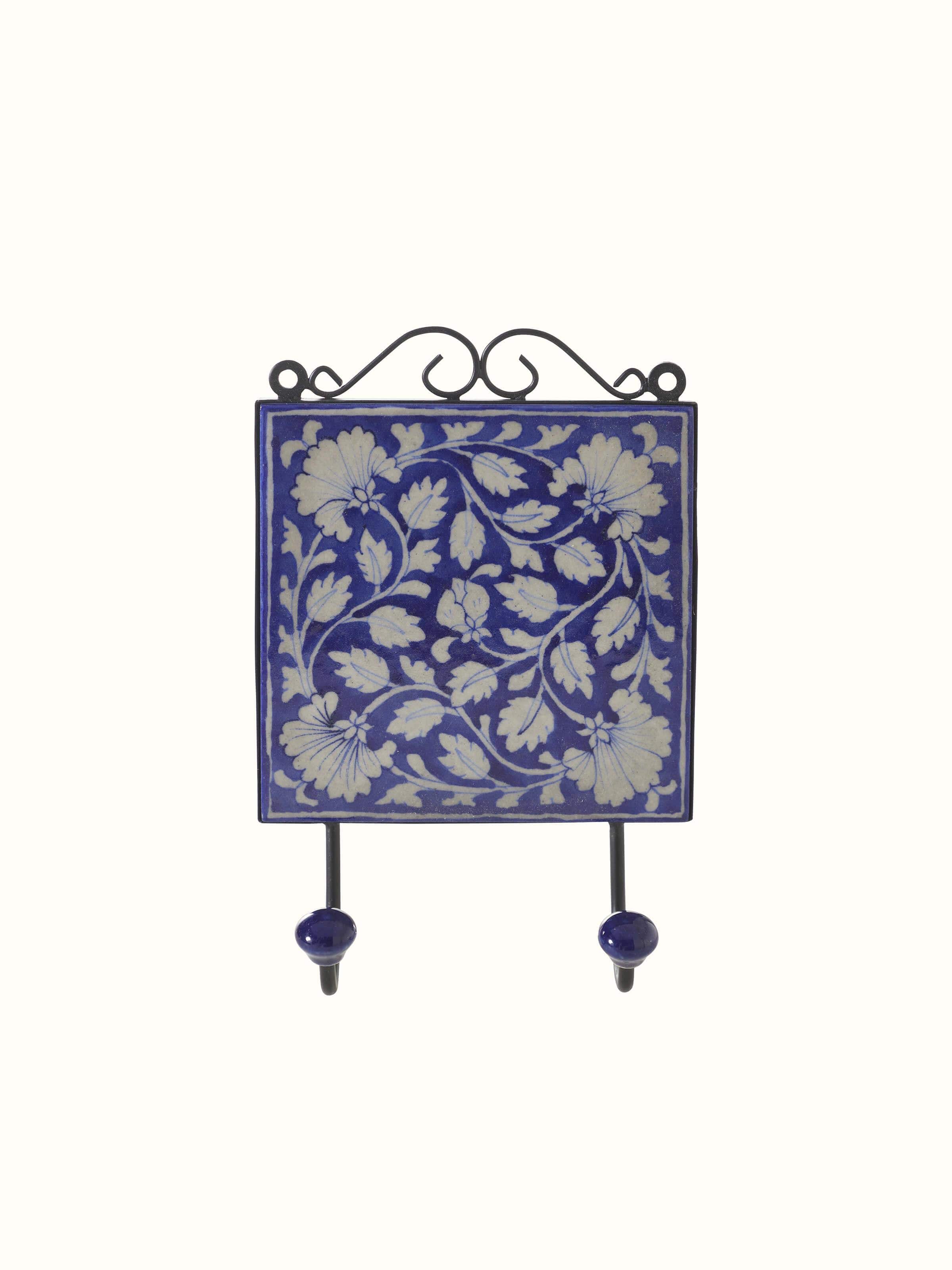 Front view of blue pottery ceramic 2-pin wall hook with decorative design