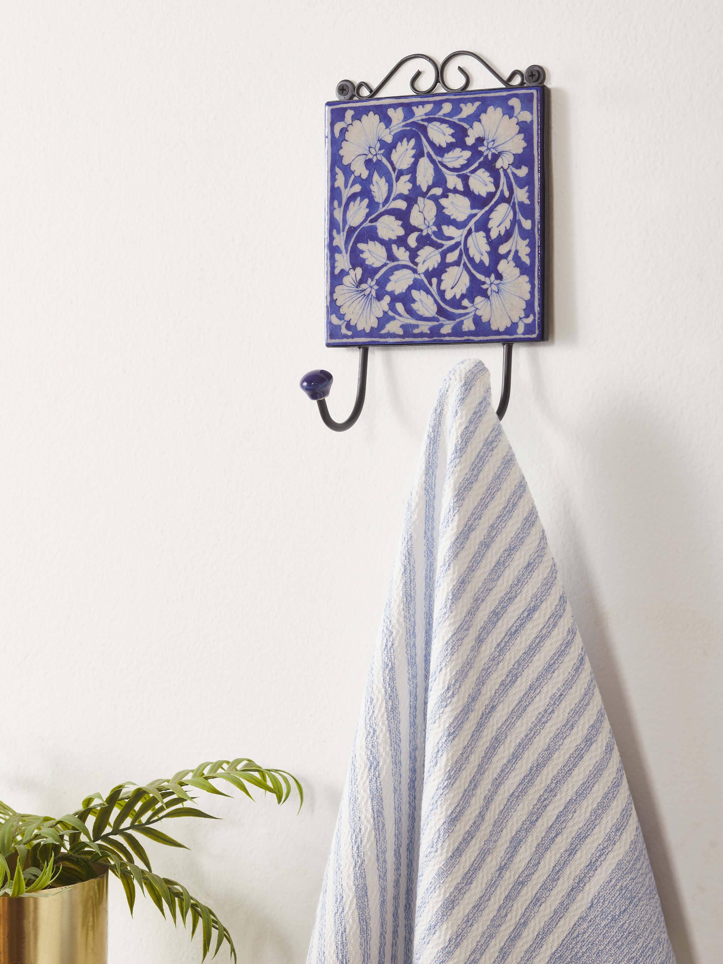 Side view of blue pottery ceramic 2-pin wall hook showcasing intricate patterns
