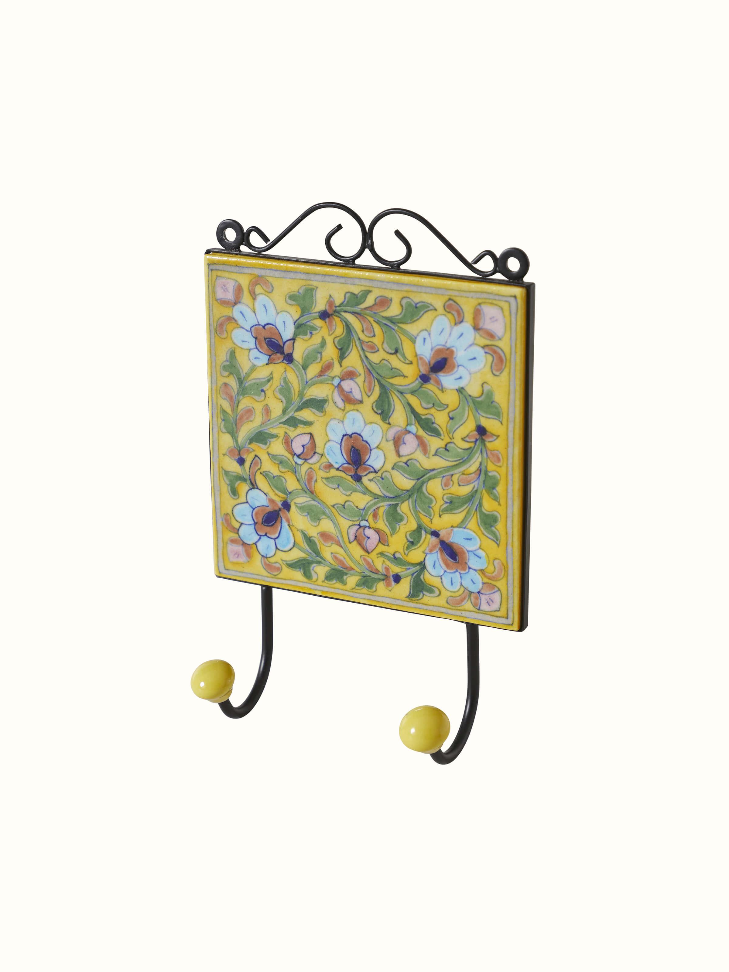 Angled view of Blue Pottery Ceramic 2-Pin Wall Hook in Yellow Color emphasizing design elements.