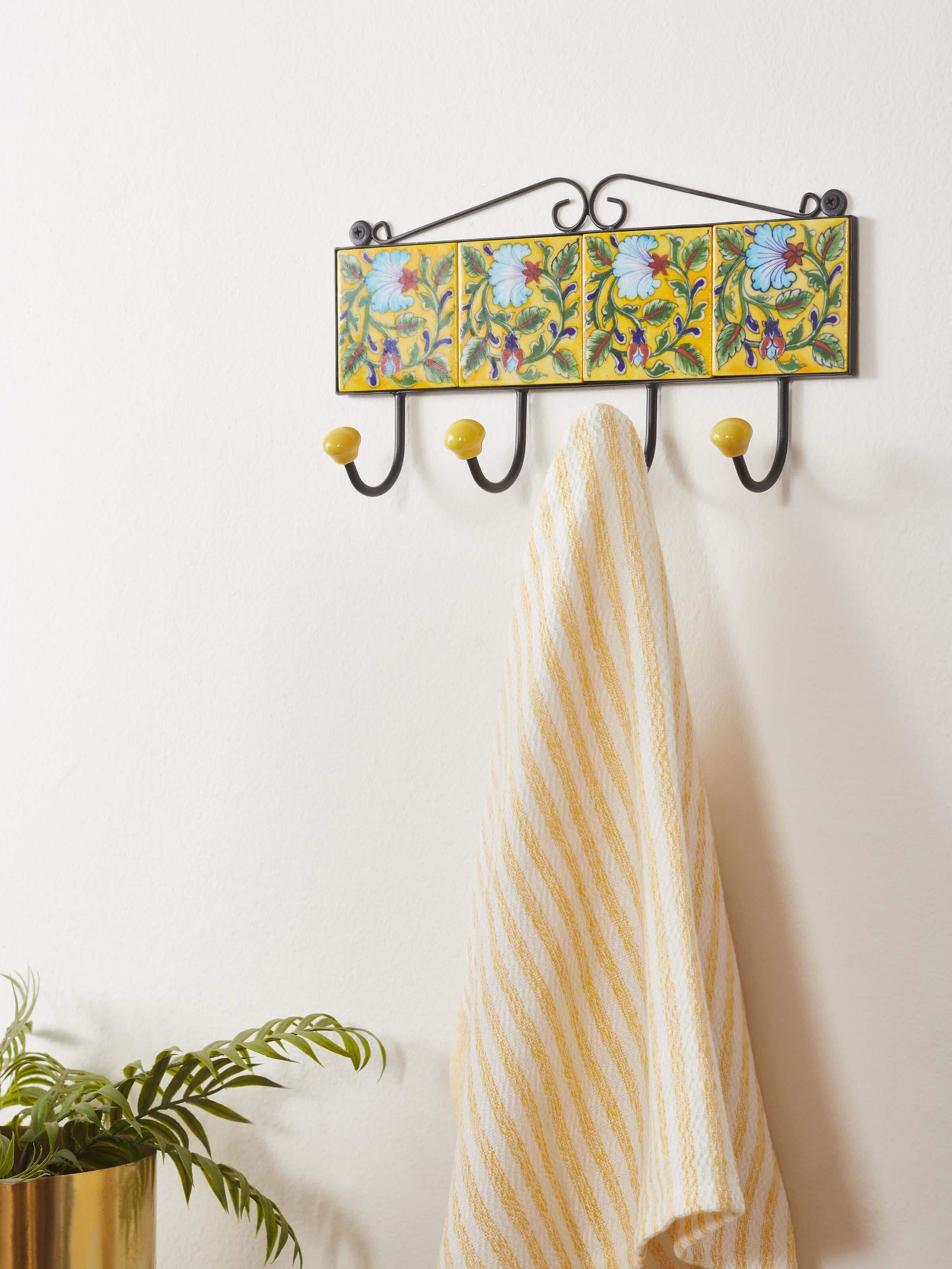 Side view of blue pottery ceramic 4-pin wall hook in yellow, highlighting the detailed blue pottery pattern and hooks.