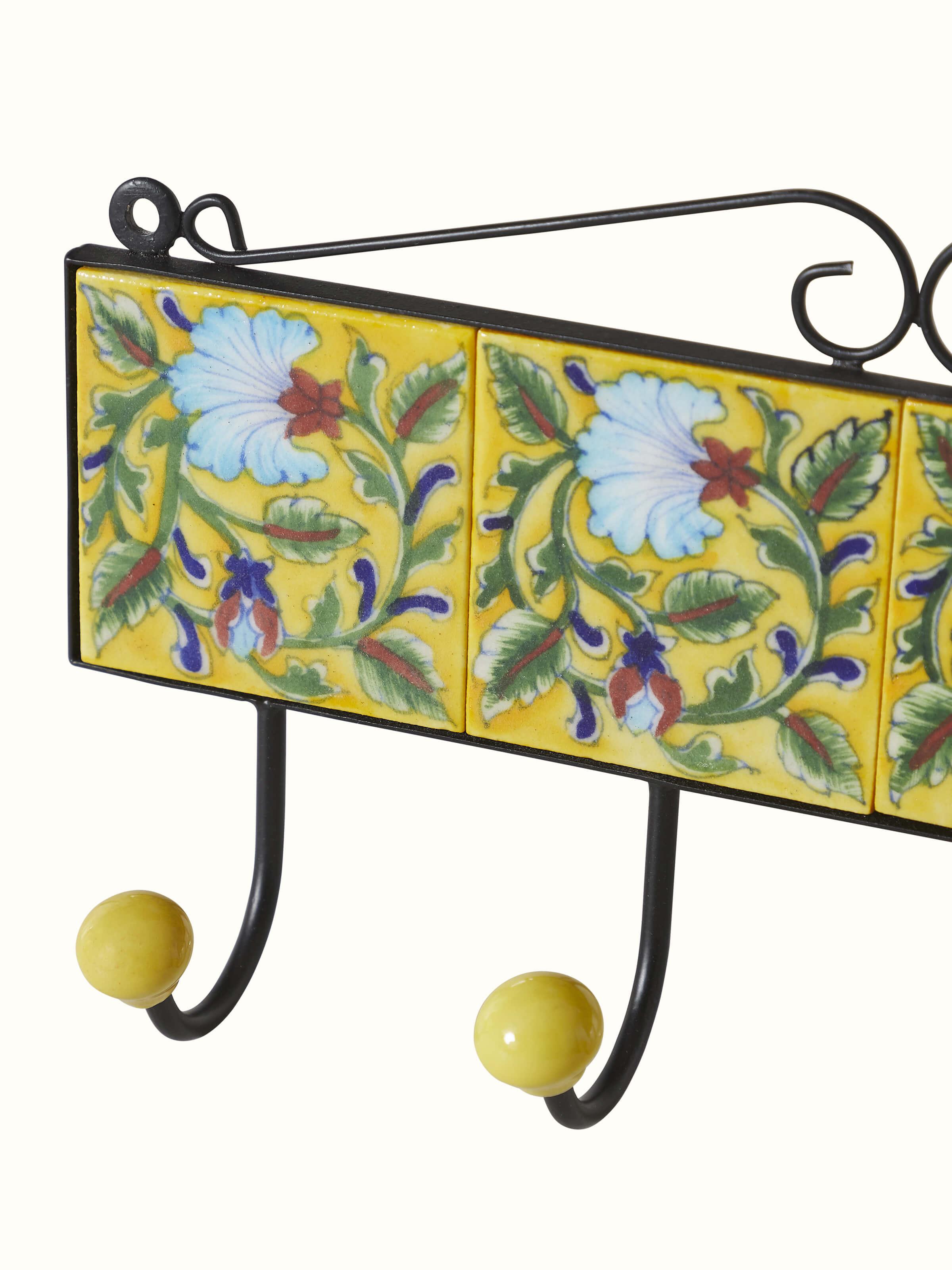 Front view of blue pottery ceramic 4-pin wall hook in yellow, showcasing the design and functionality of the wall hook.