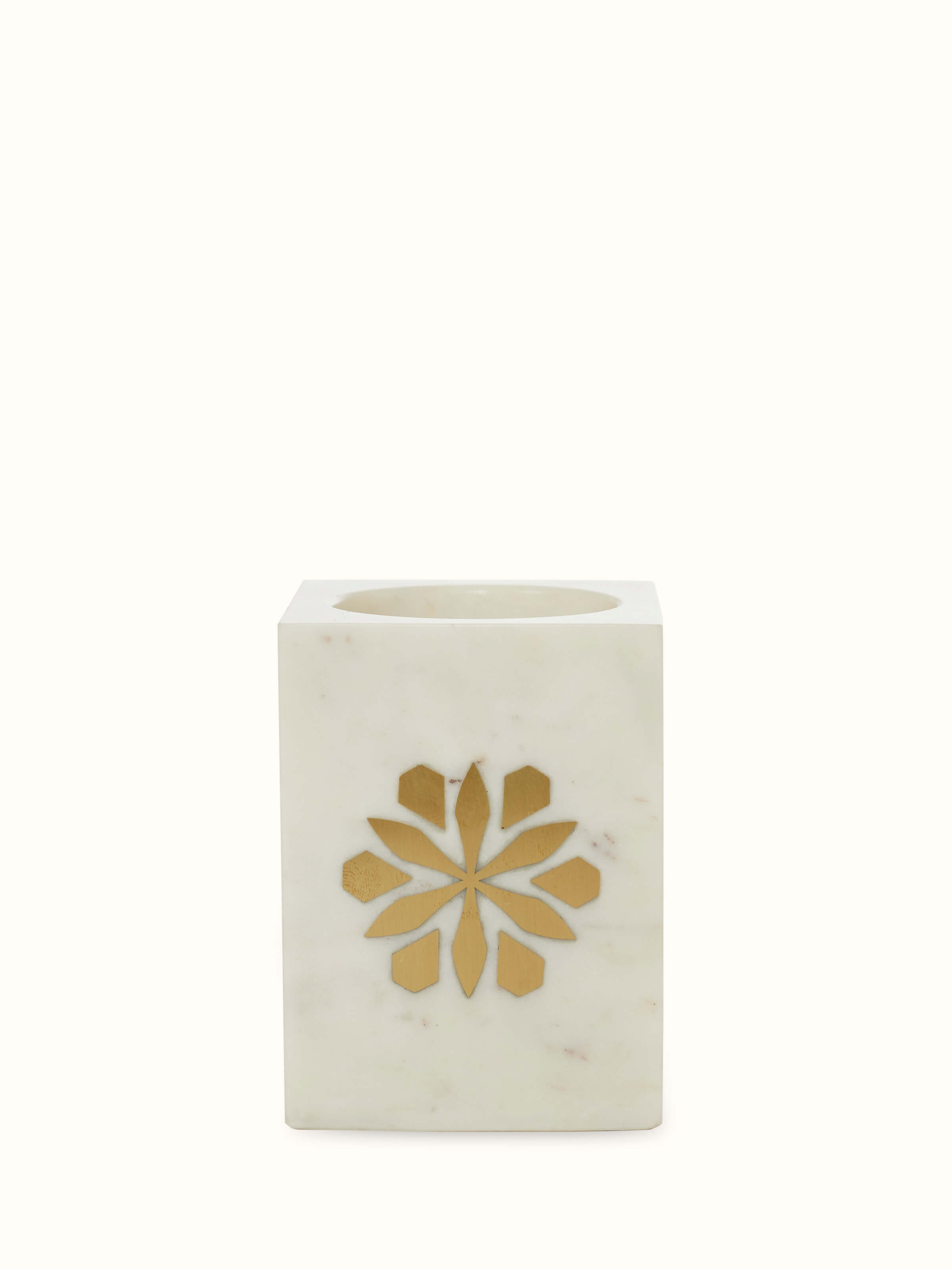 Close-up view of the marble and brass toothbrush holder, highlighting detailed craftsmanship and glossy finish.