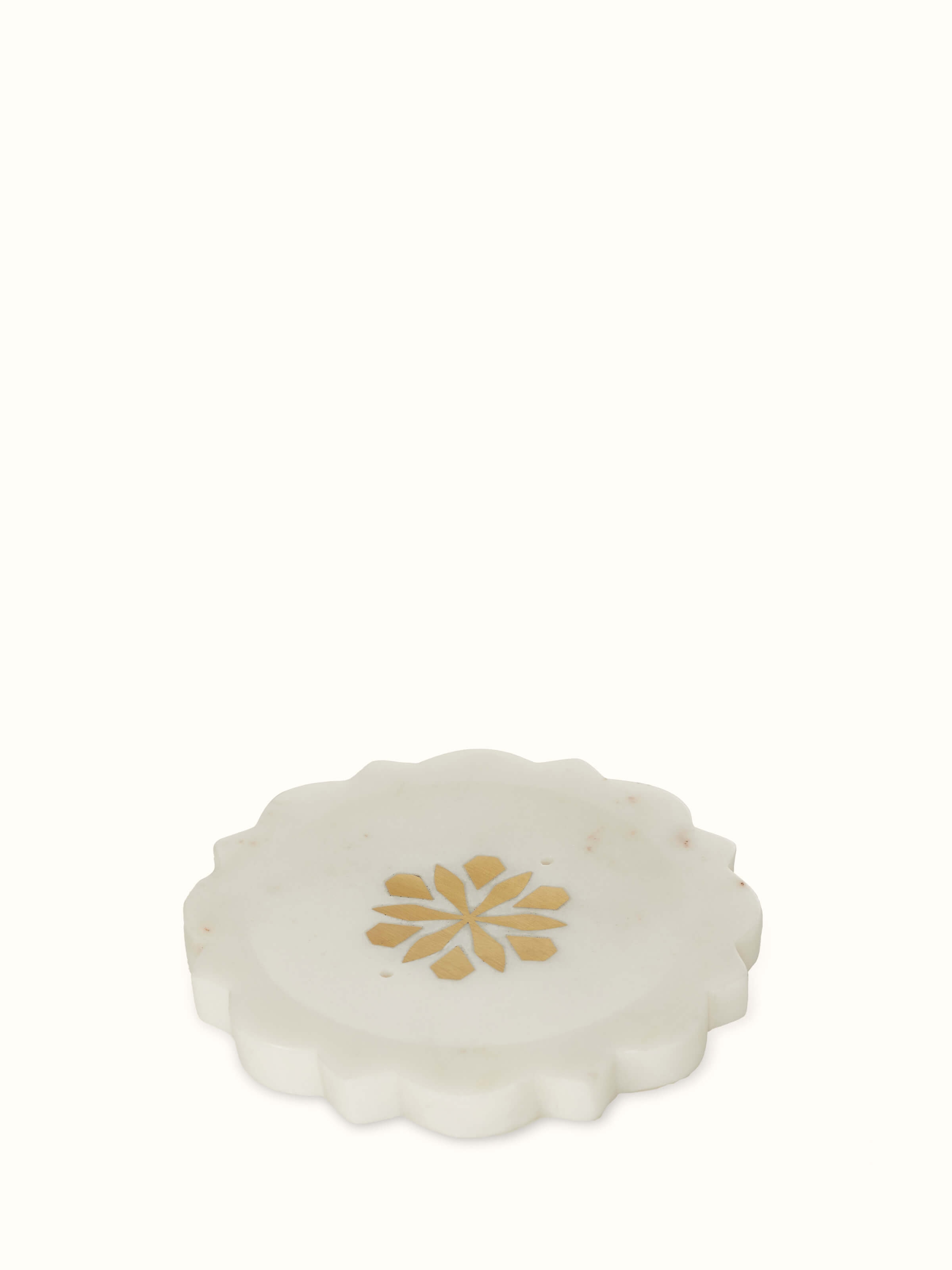 Close-up of stone-worked marble and brass soap dish in gold color, highlighting its luxurious finish and intricate design.