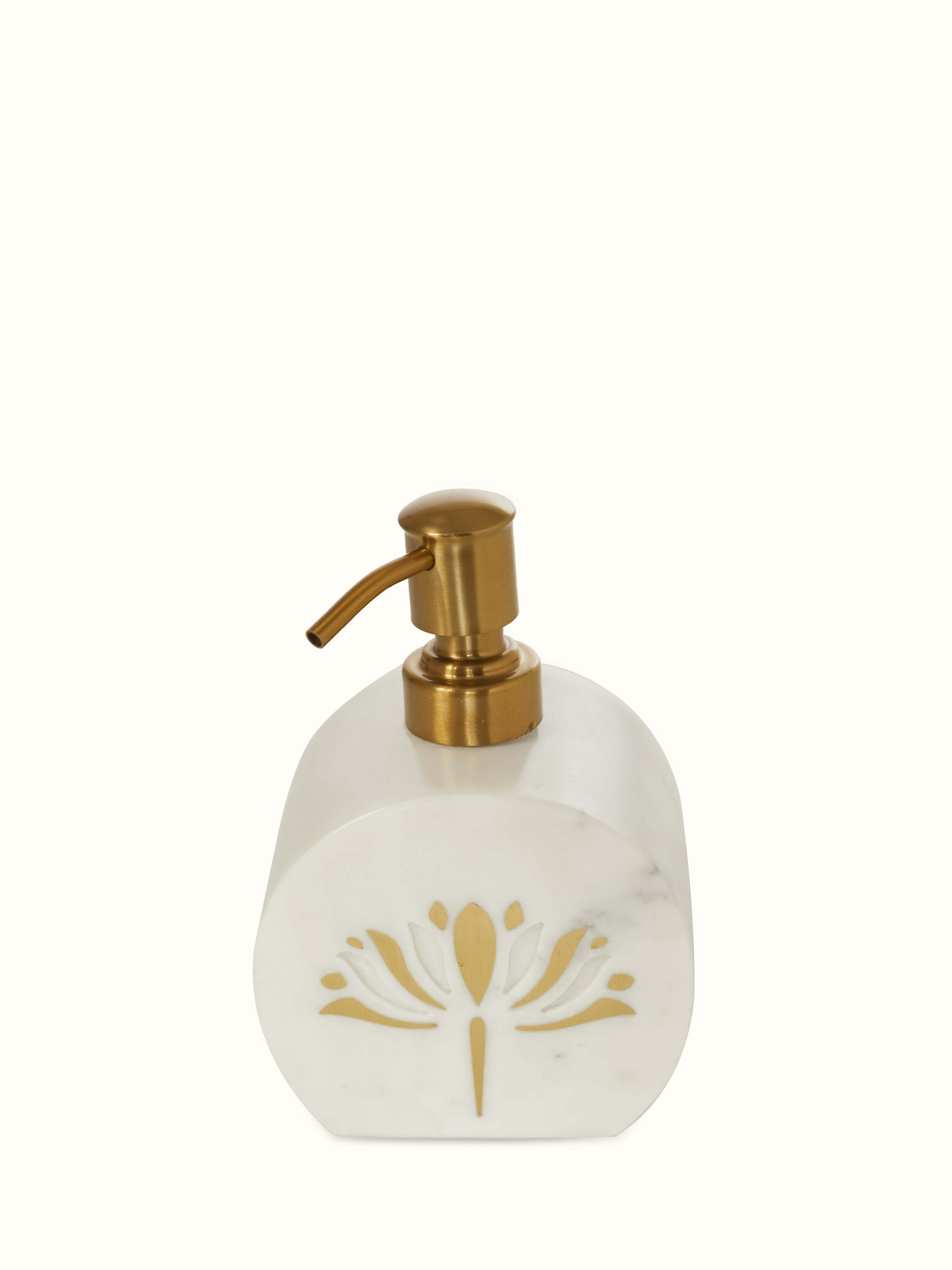 Close-up top view of stone-worked marble and brass soap dispenser in gold color emphasizing the quality.