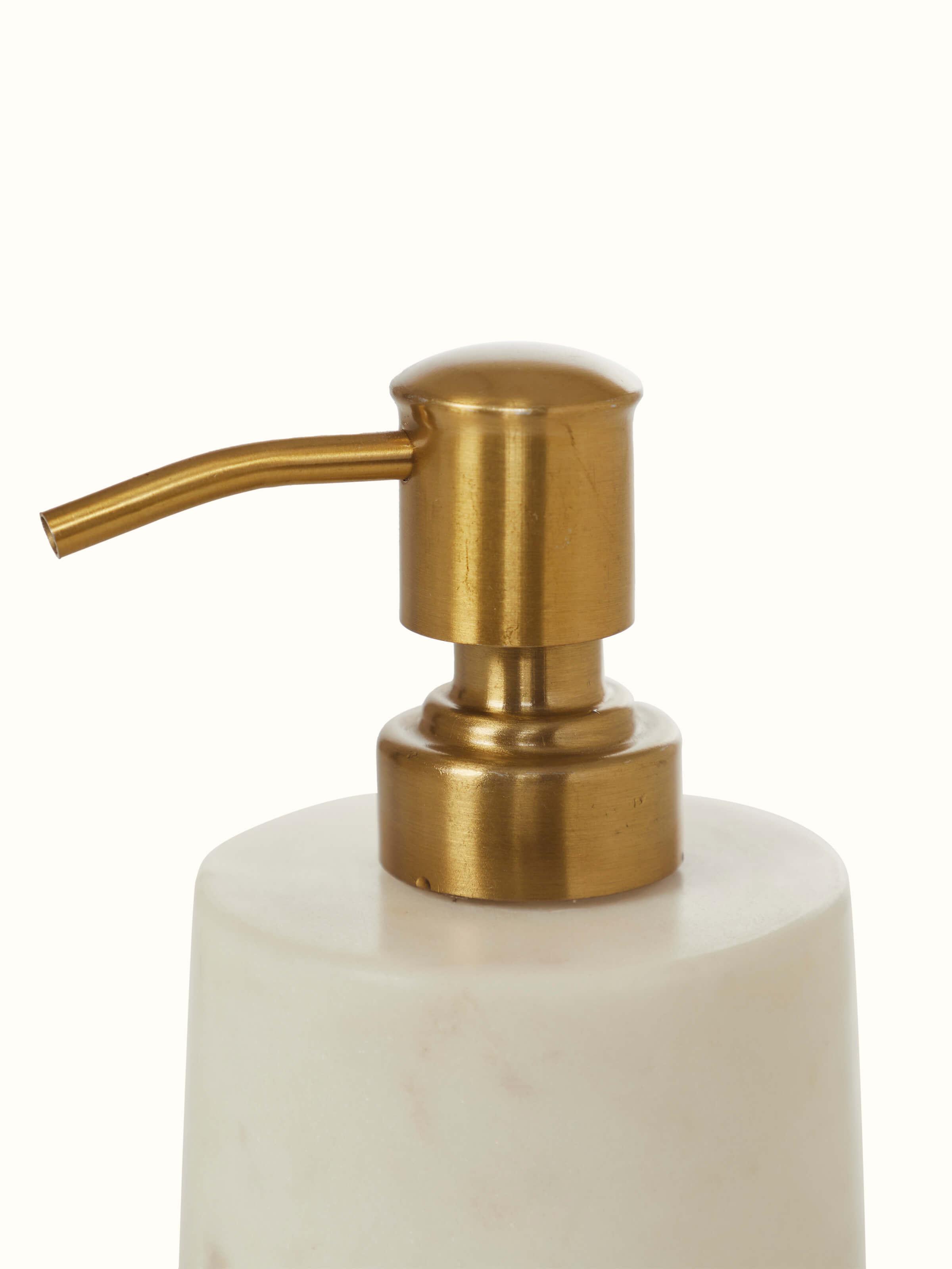 Close-up view of Stone-worked marble & brass soap dispenser in white color showcasing its intricate details.