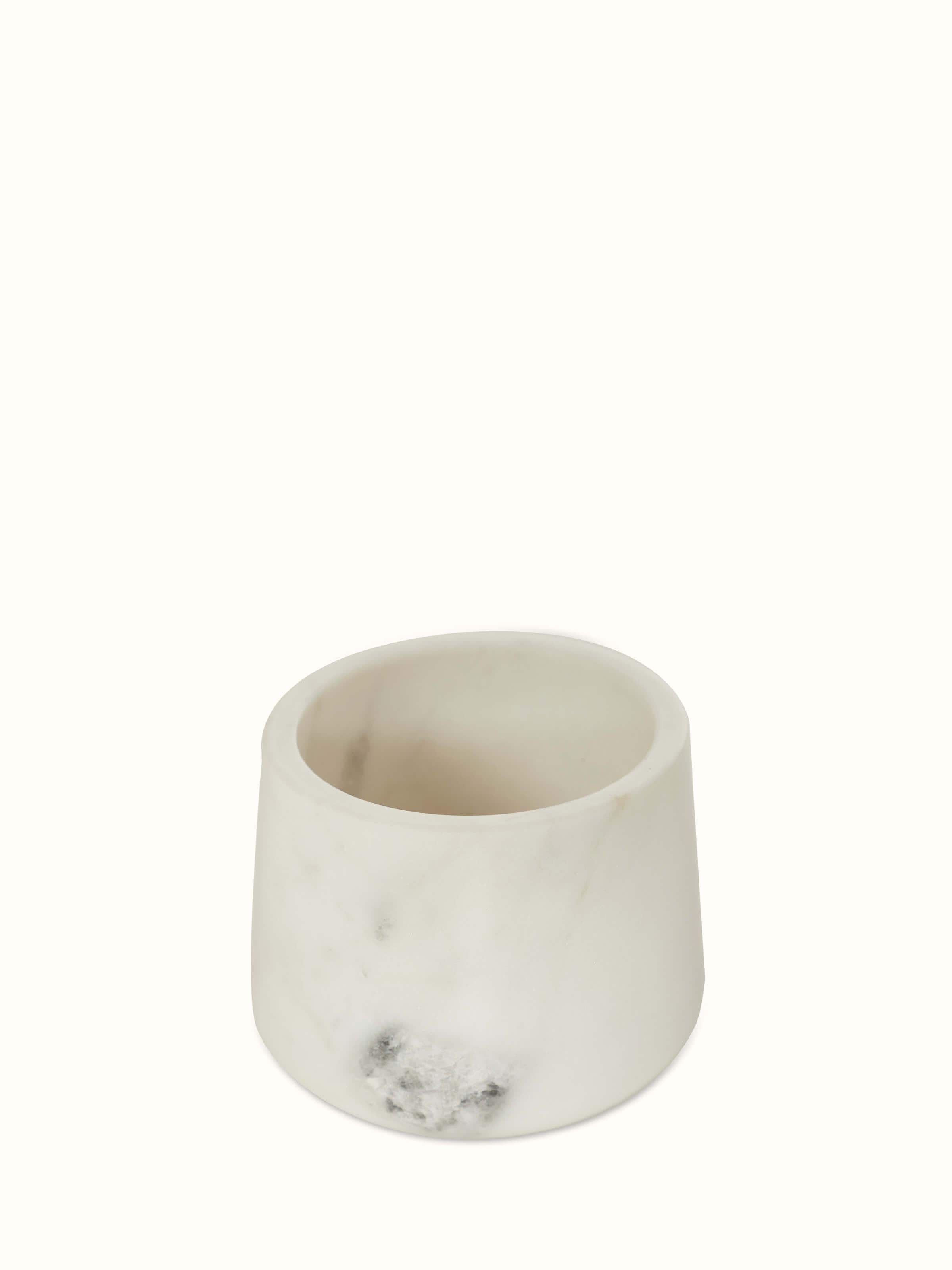 Artistic view of glossy stone-worked marble cotton bud holder with focus on marble texture and glossy appearance