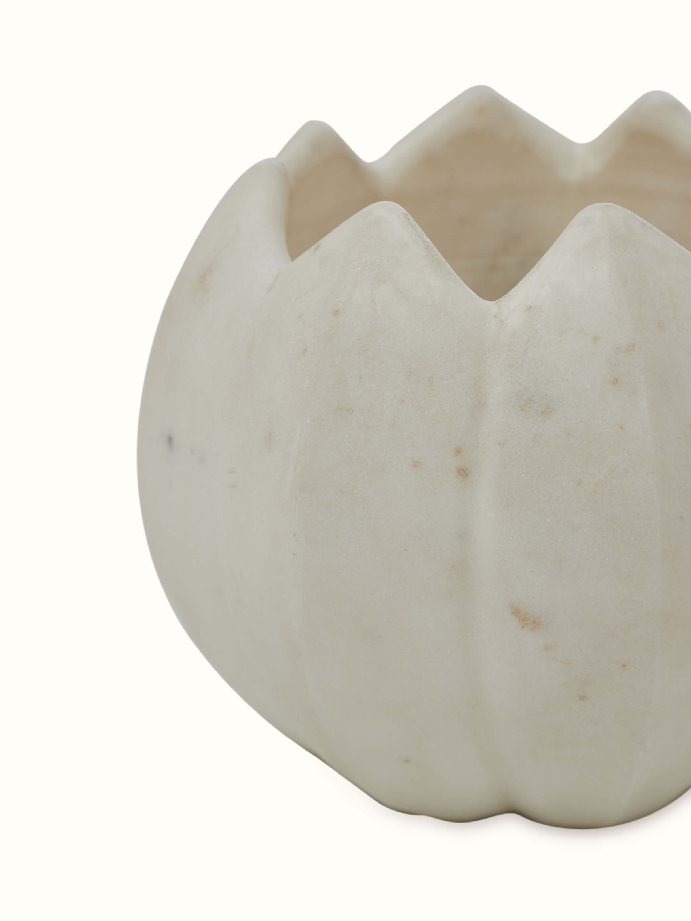 Close-up view of Stone-worked dodeca lotus white marble planter