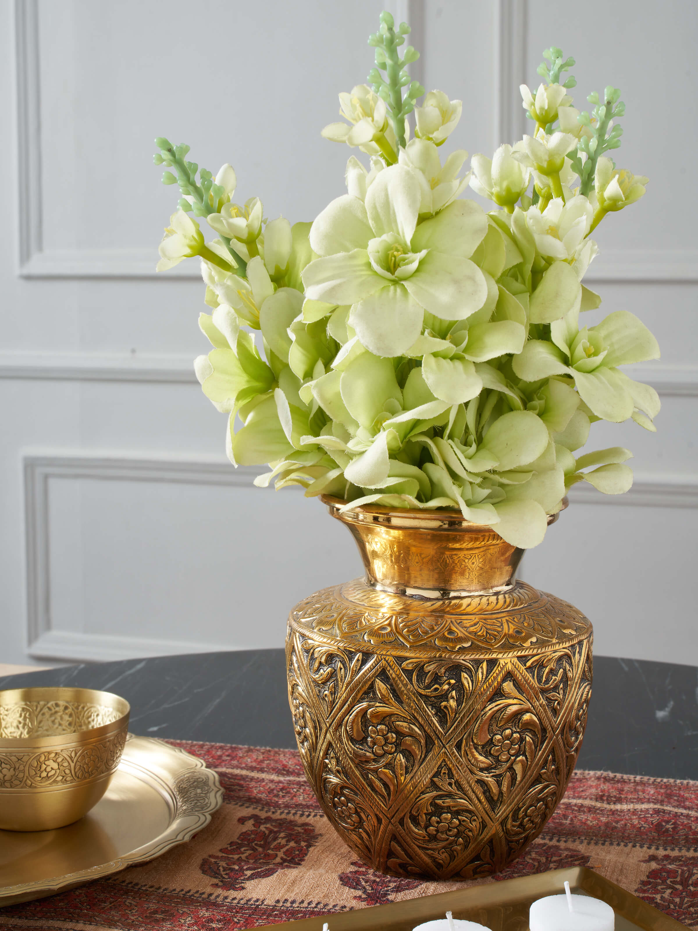 Side view of Polished brass table vase