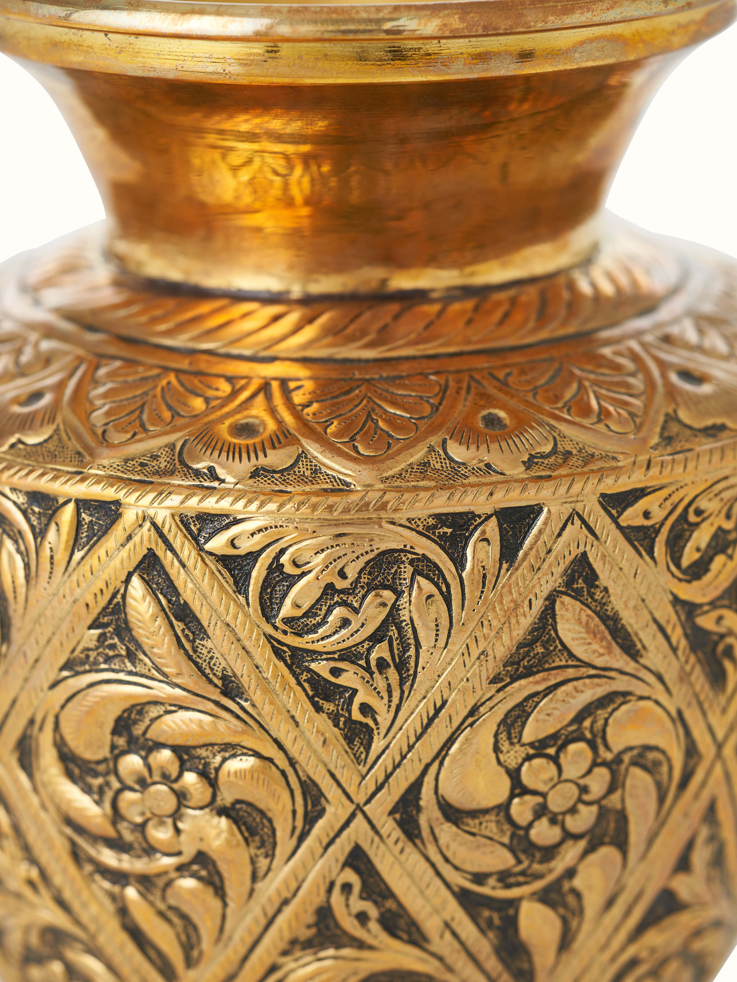 Close-up view of Polished brass table vase