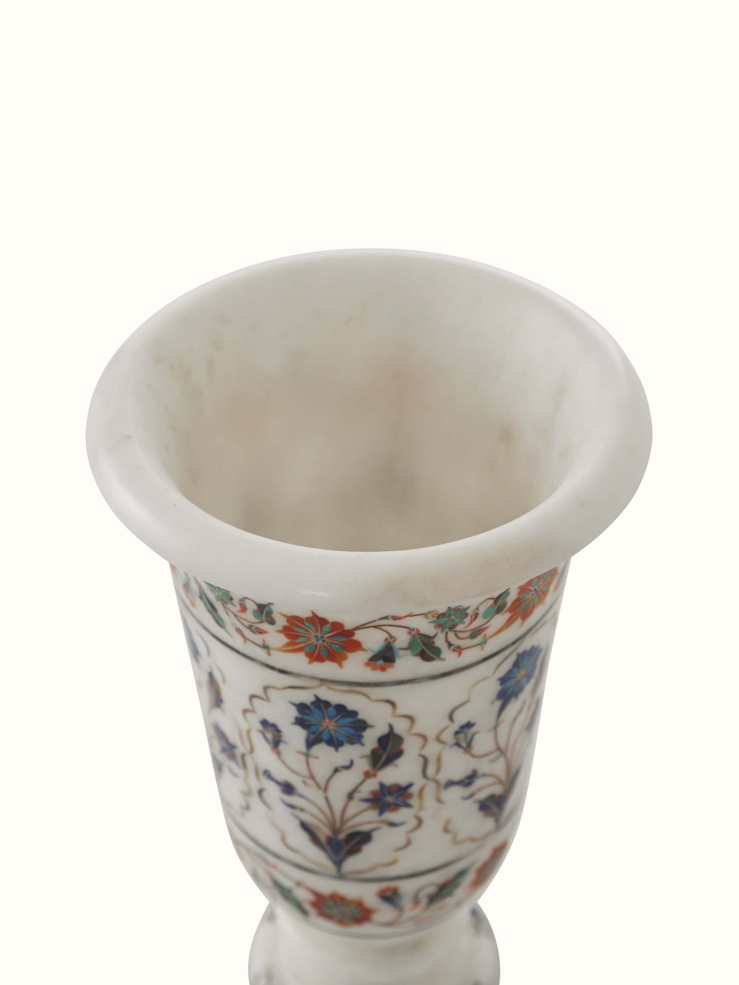 Side view of Pacchikari marble floral table vase in white, emphasizing the intricate floral patterns and smooth marble surface, Swadesh