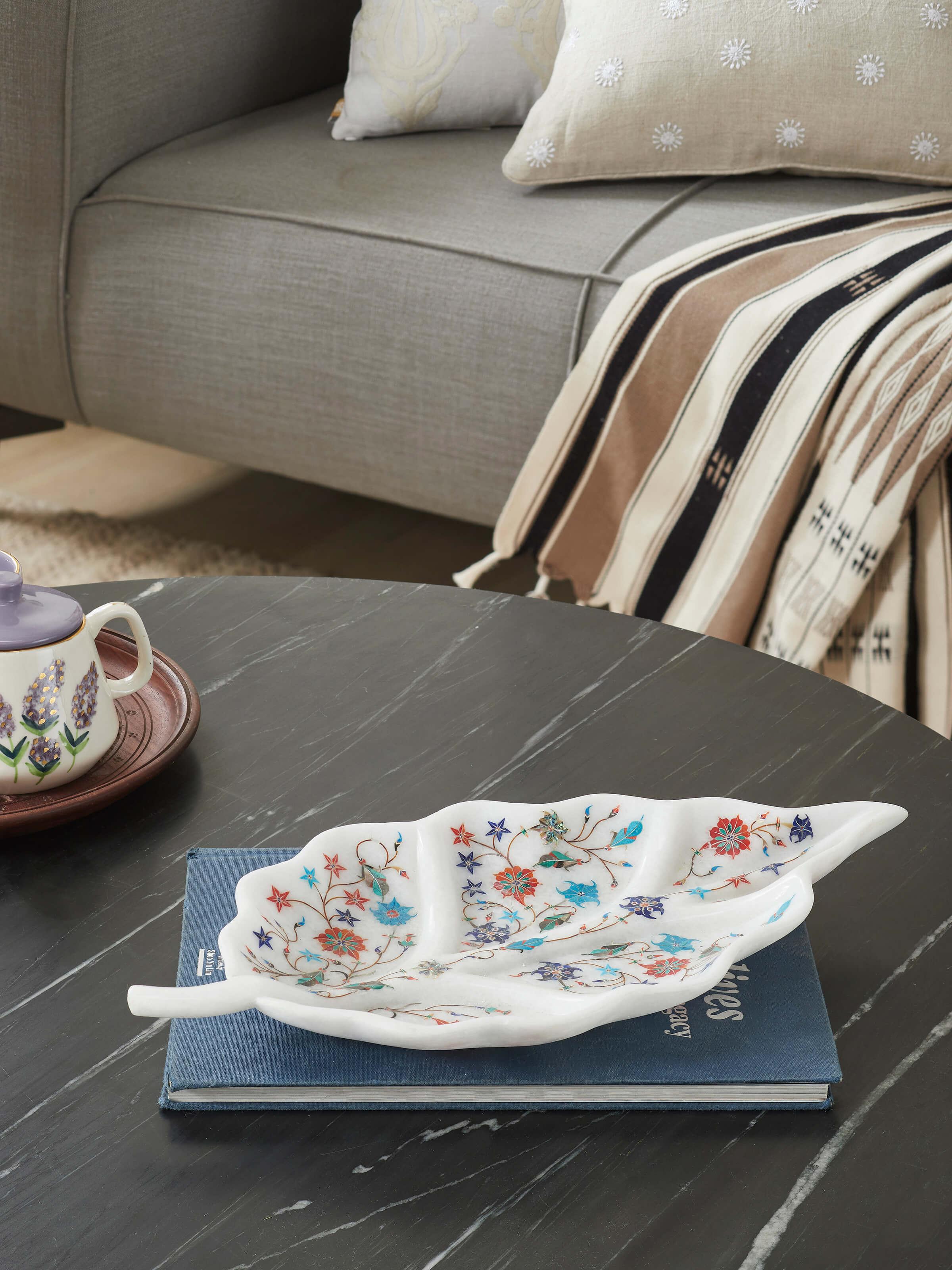 Side view of Pacchikari marble betel leaf decorative tray highlighting its elegant design.