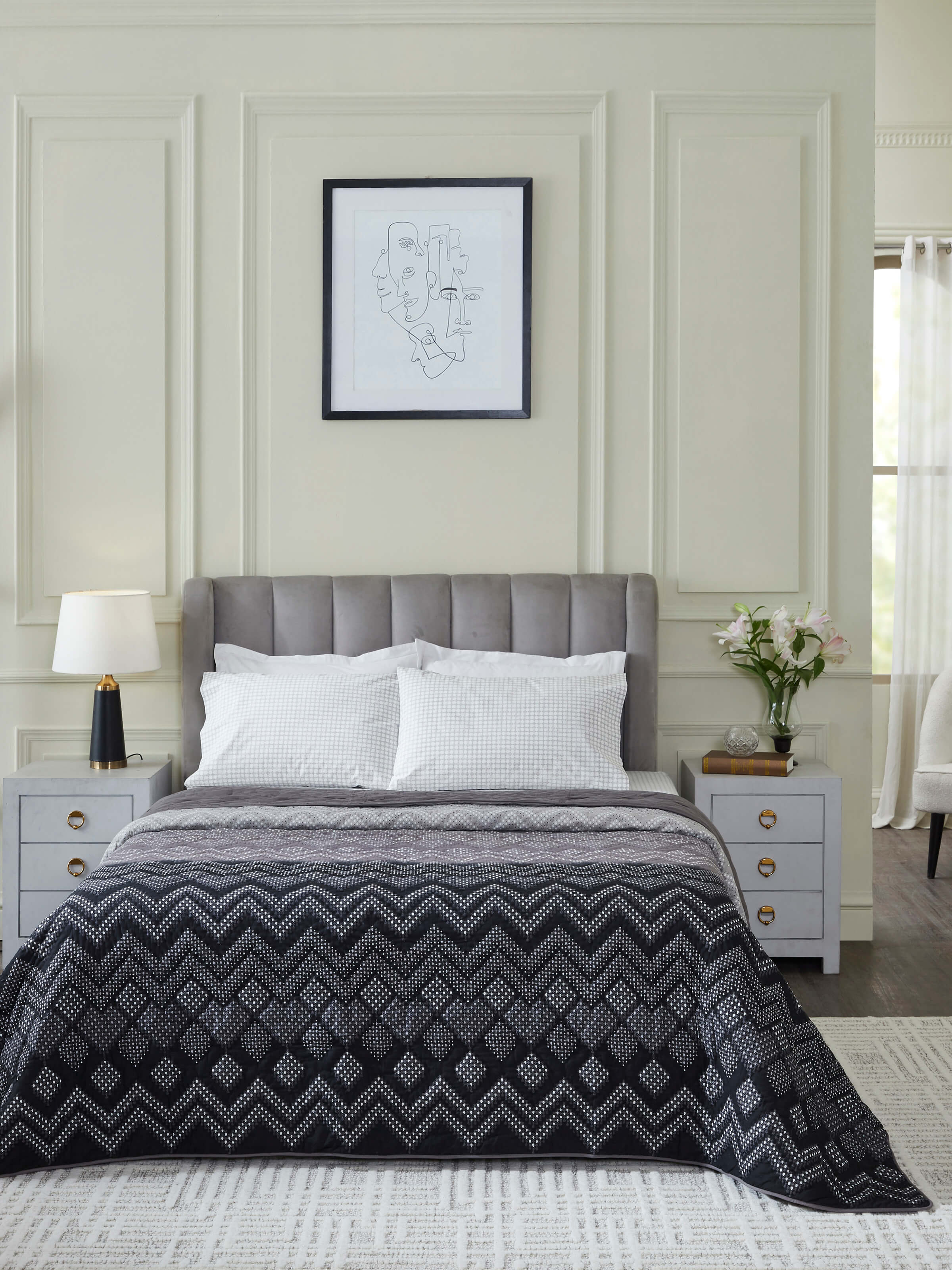 Side view of Rambagh Grey Ombre Geo Cotton Sanganeri Block Printed Double Quilt highlighting the quilt's thickness and edge.