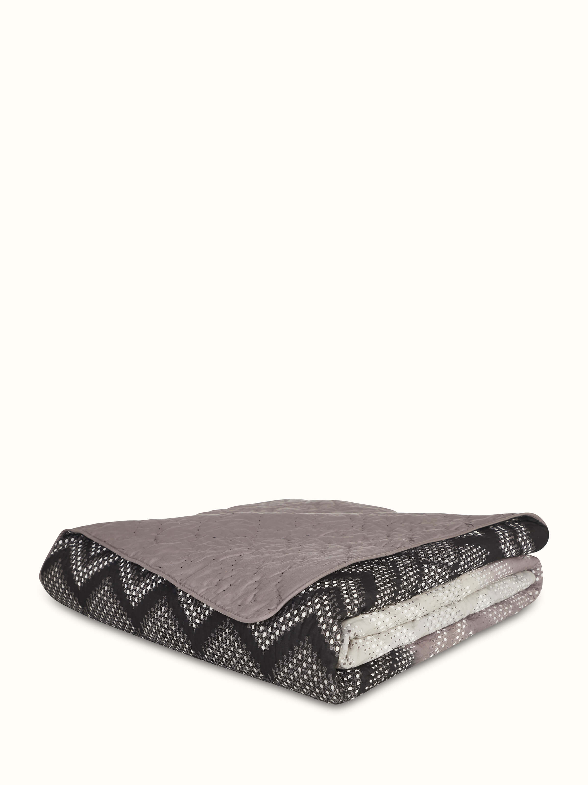 Close-up of Rambagh Grey Ombre Geo Cotton Sanganeri Block Printed Double Quilt focusing on the ombre and geometric patterns.