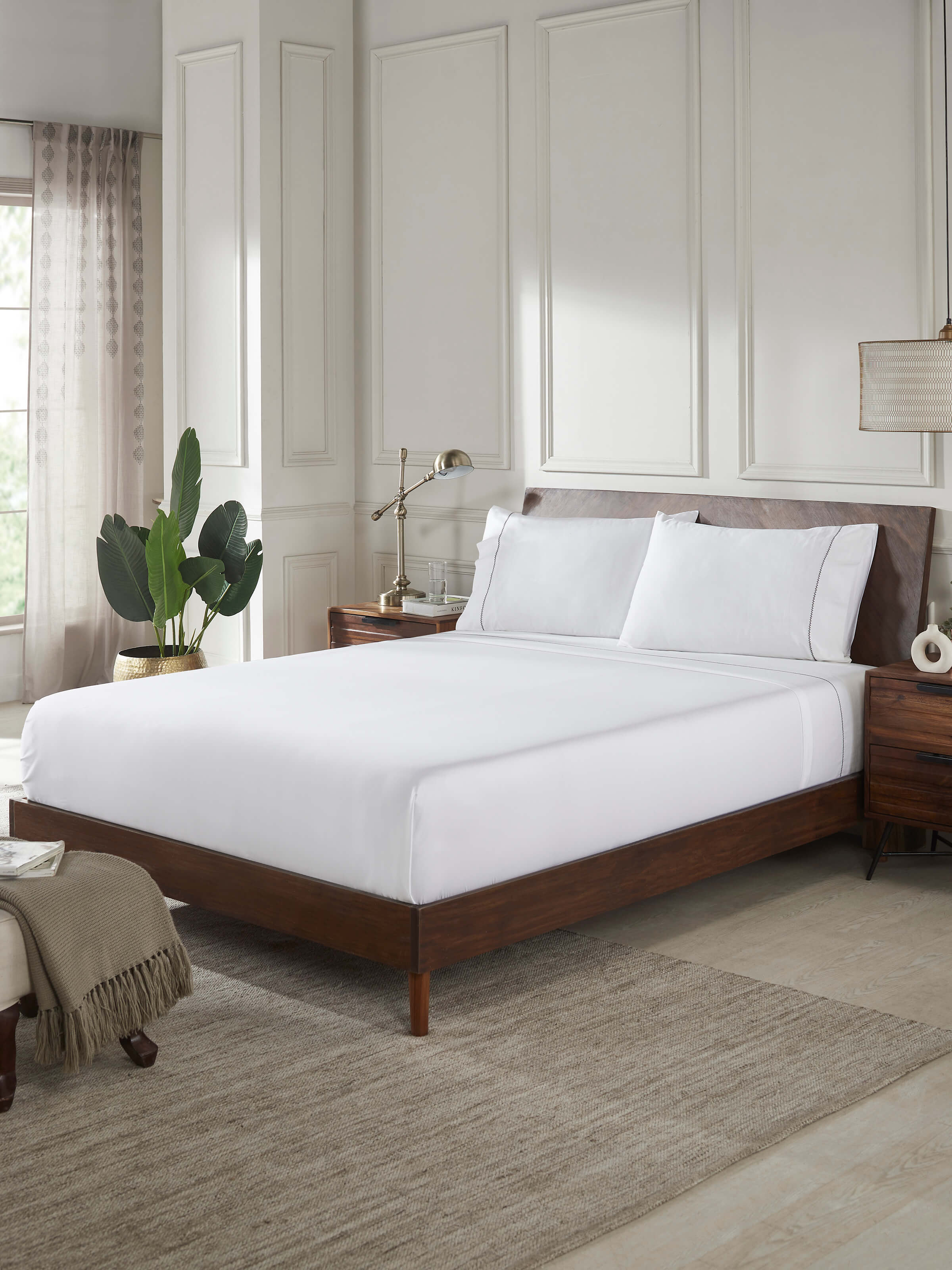 Close-up of Rambagh grey stripe cotton hand embroidered bedsheet king set, highlighting the detailed embroidery and striped pattern.