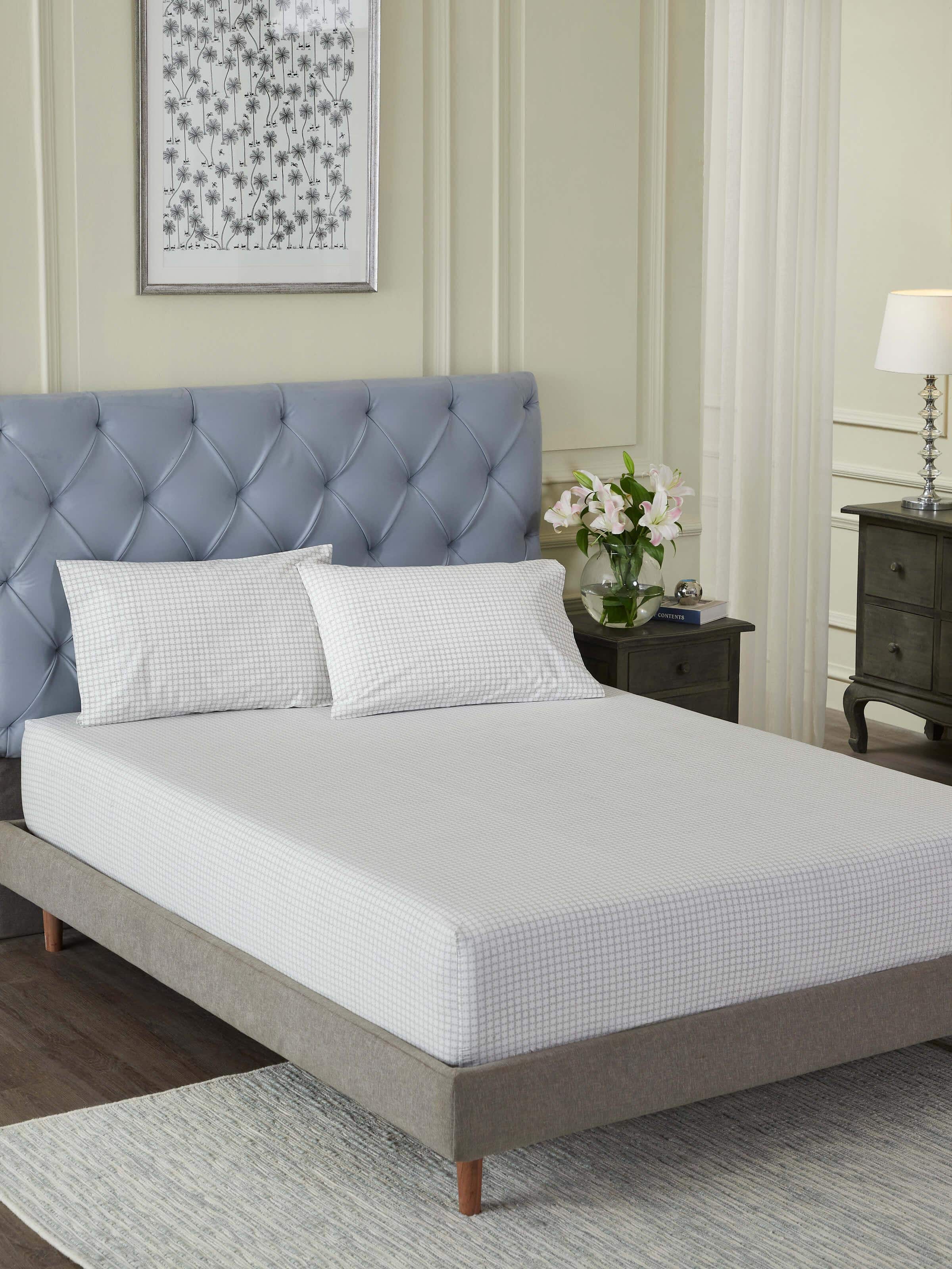 Close-up of Pratidin grey grid cotton Sanganeri block printed queen fitted bedsheet set highlighting the fine grid print and soft fabric.