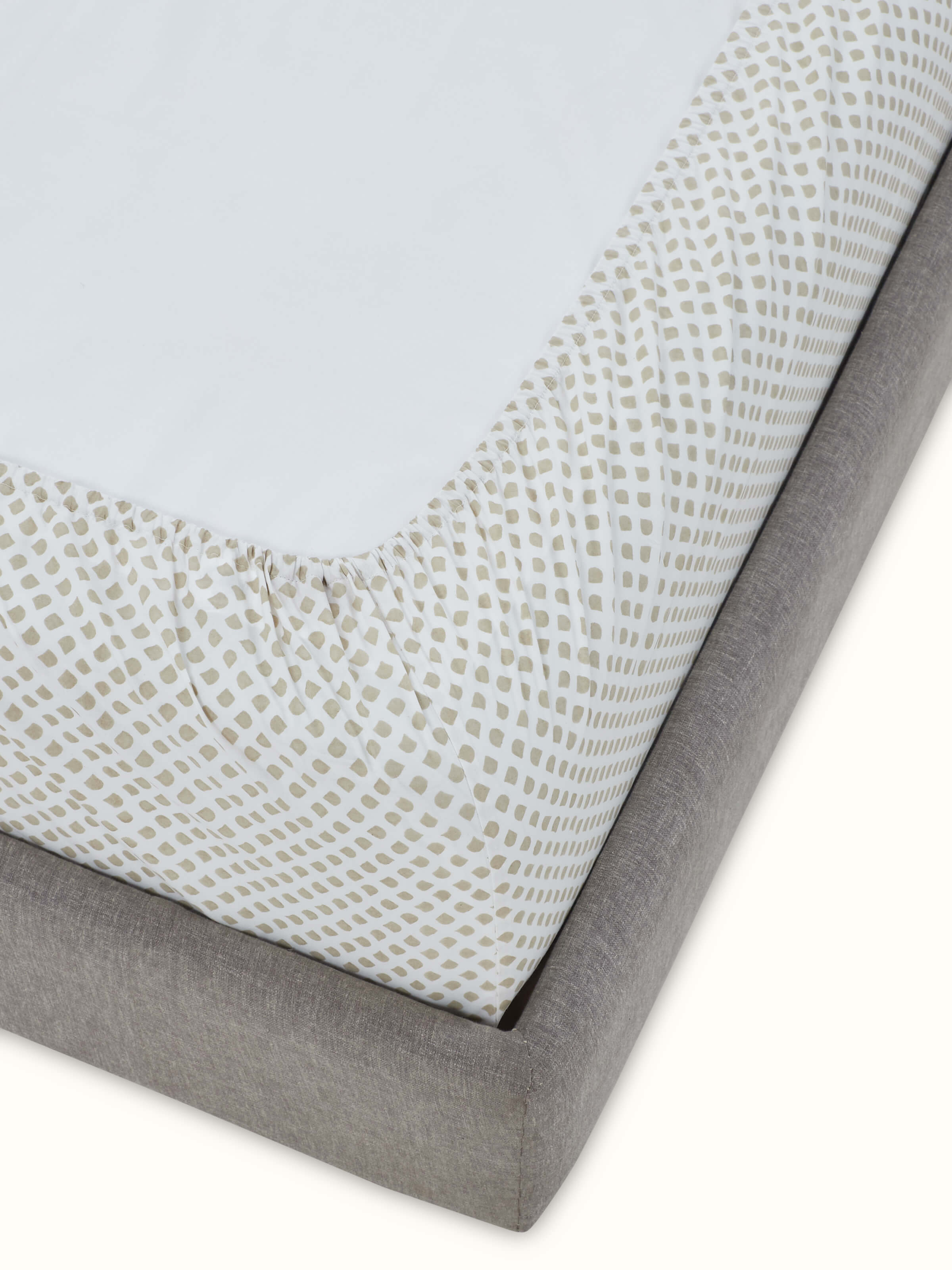 Detailed view of Pratidin beige scallop cotton Sanganeri block printed queen fitted bedsheet set showing the block print pattern and fabric quality.