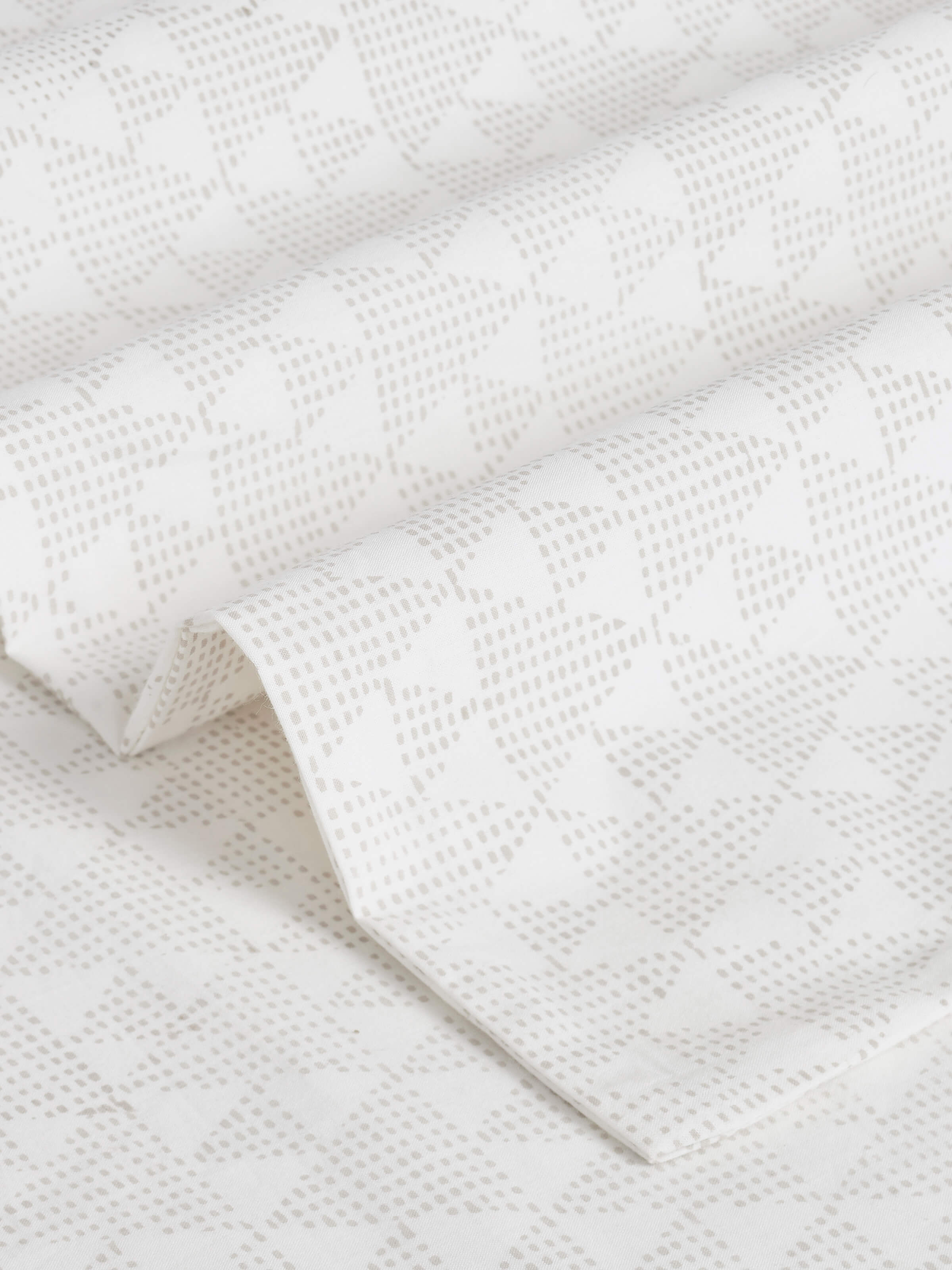 Close-up view of Pratidin Beige Geometric Cotton Sanganeri Block Printed Queen Bedsheet Set (3 pcs) showing the intricate block print details.