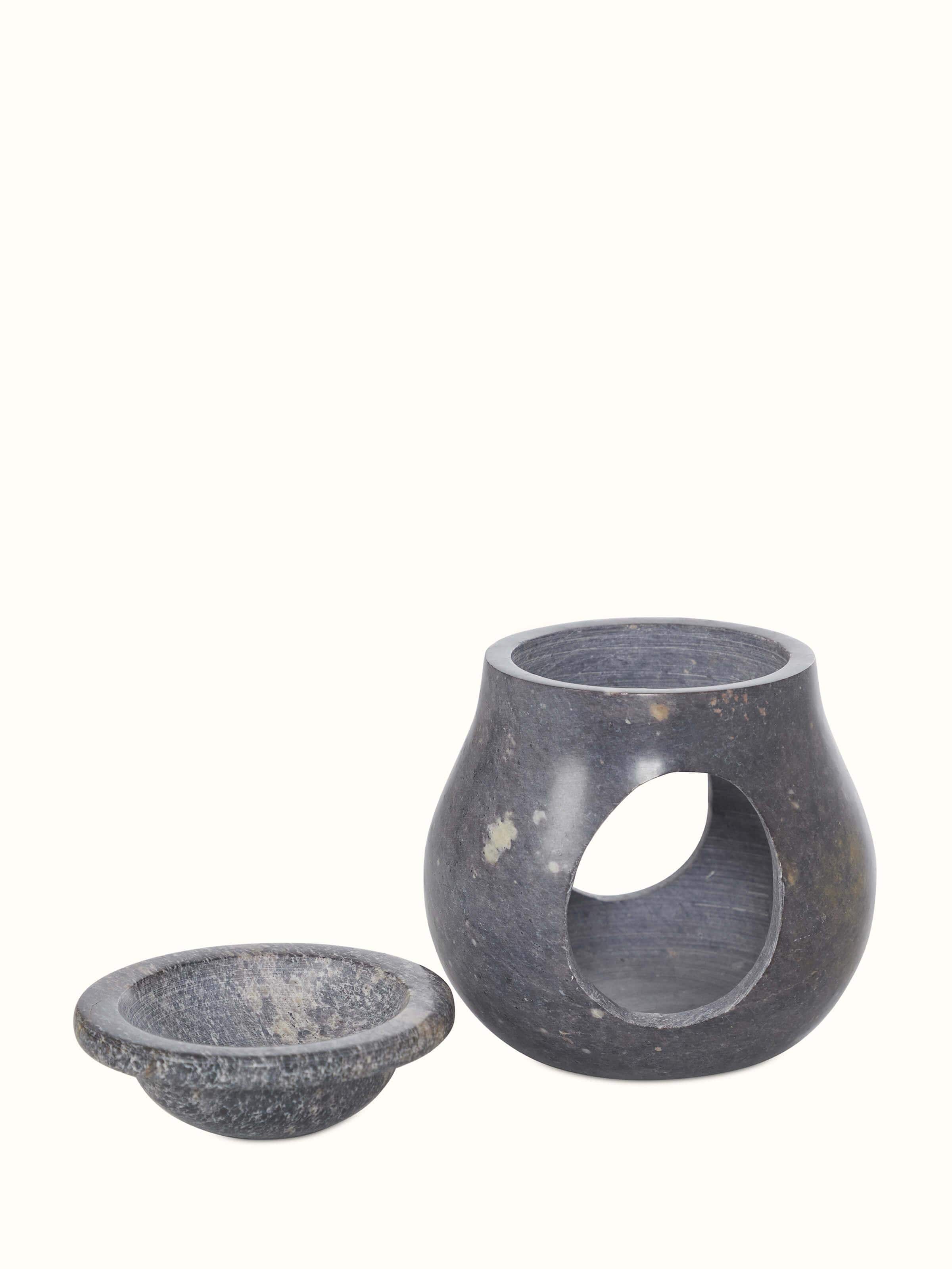 Front view of natural carved stone diffuser from Swadesh, showing the unique stone carving and elegant shape.