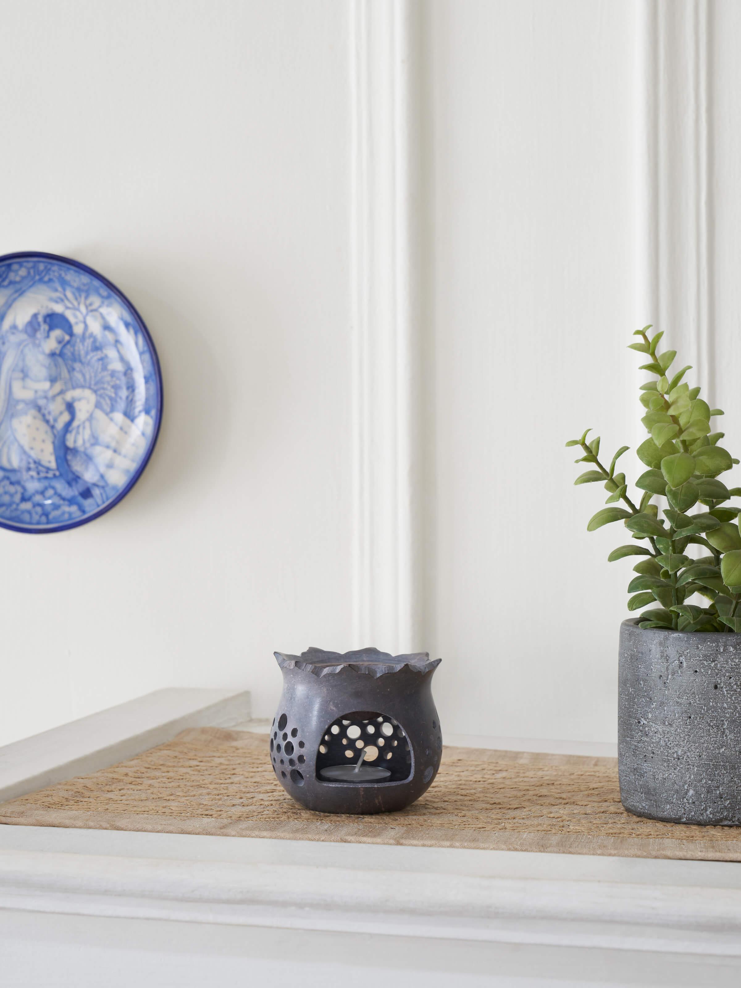 Side view of hand-carved stone diffuser.